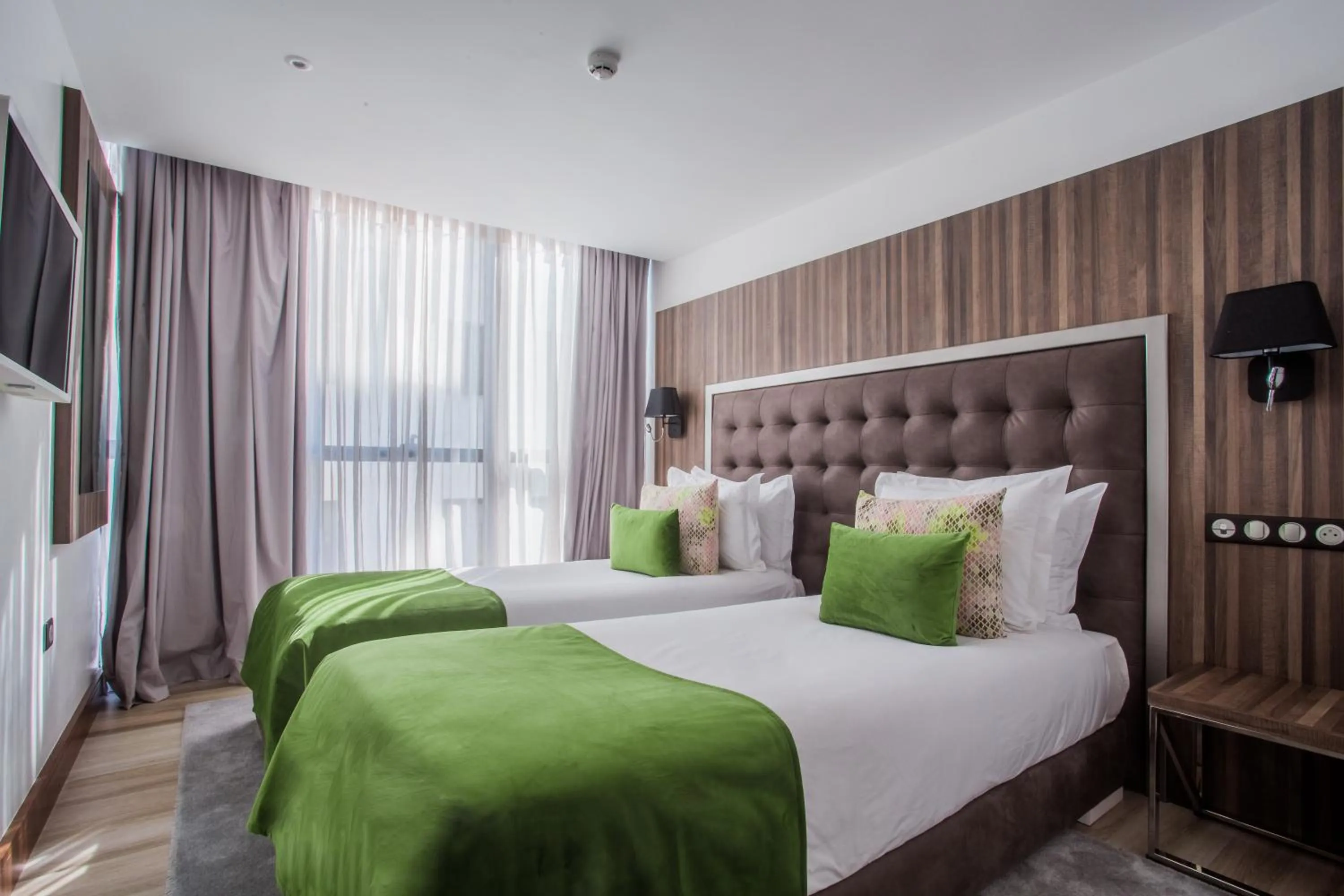 Bed in SBN Suite Hôtel