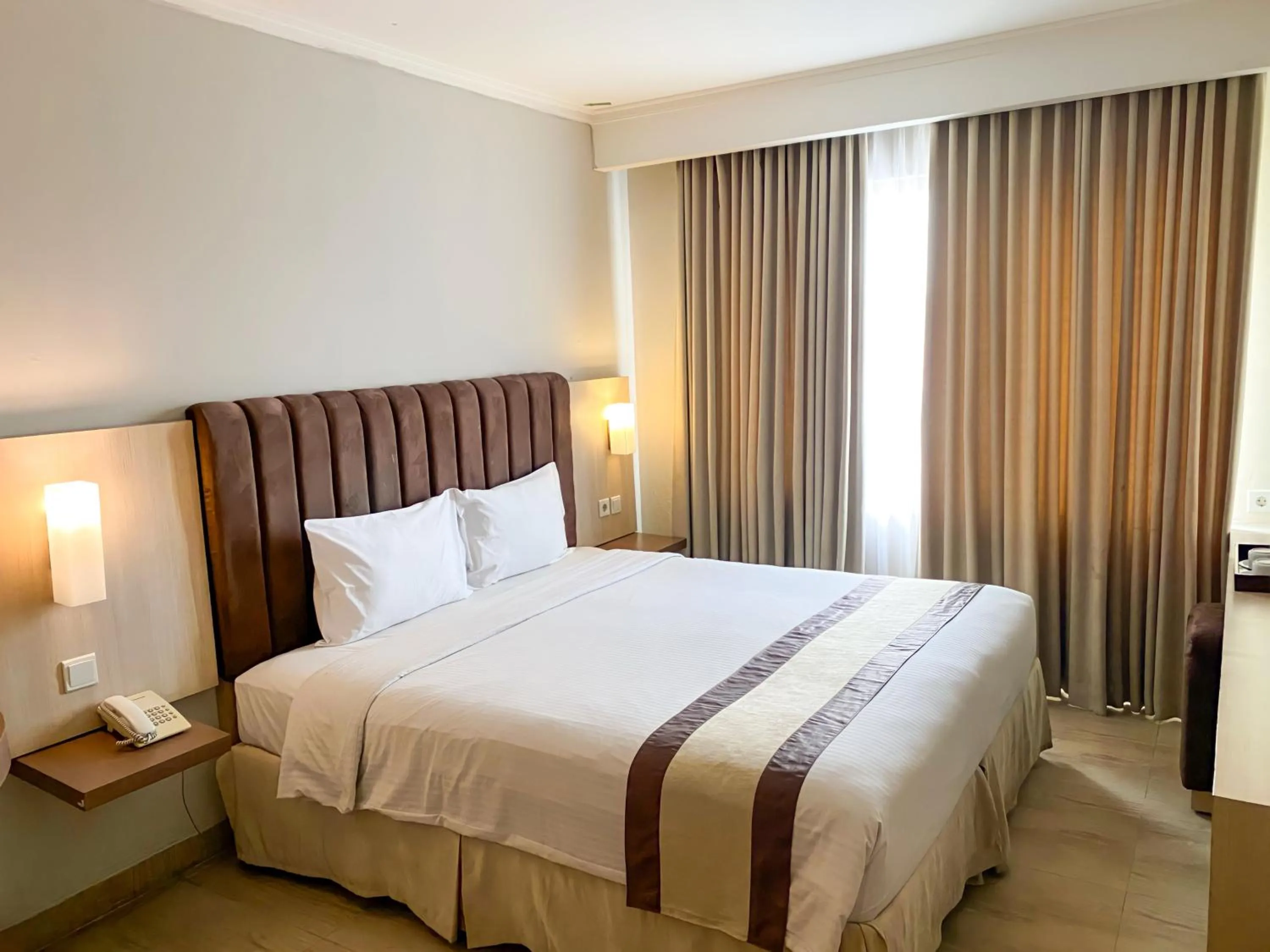 Bed in Bueno Colombo Hotel Yogyakarta