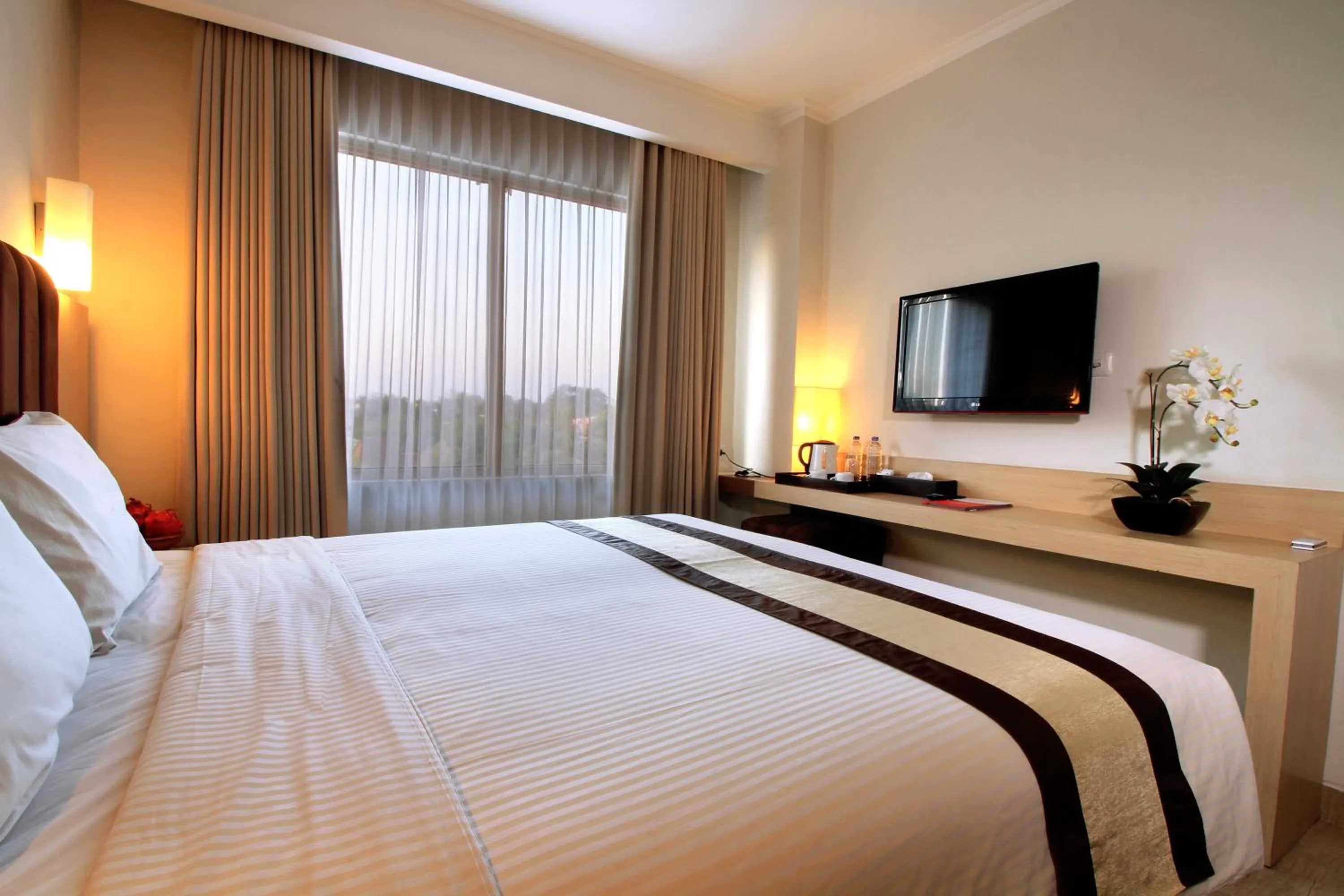 Bed in Bueno Colombo Hotel Yogyakarta