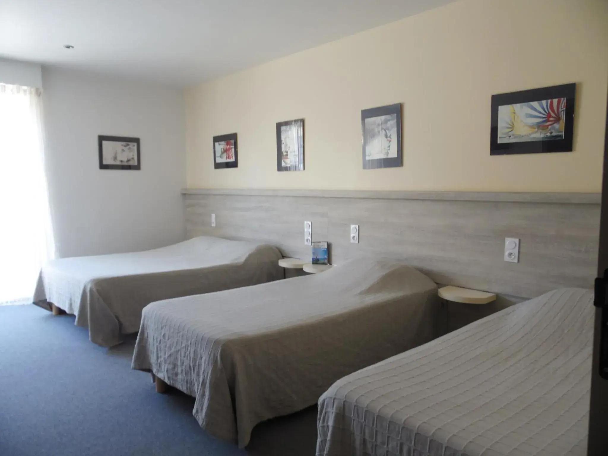 Quadruple Room in Hôtel du Petit Matelot Quadruple Room in Hôtel du Petit Matelot