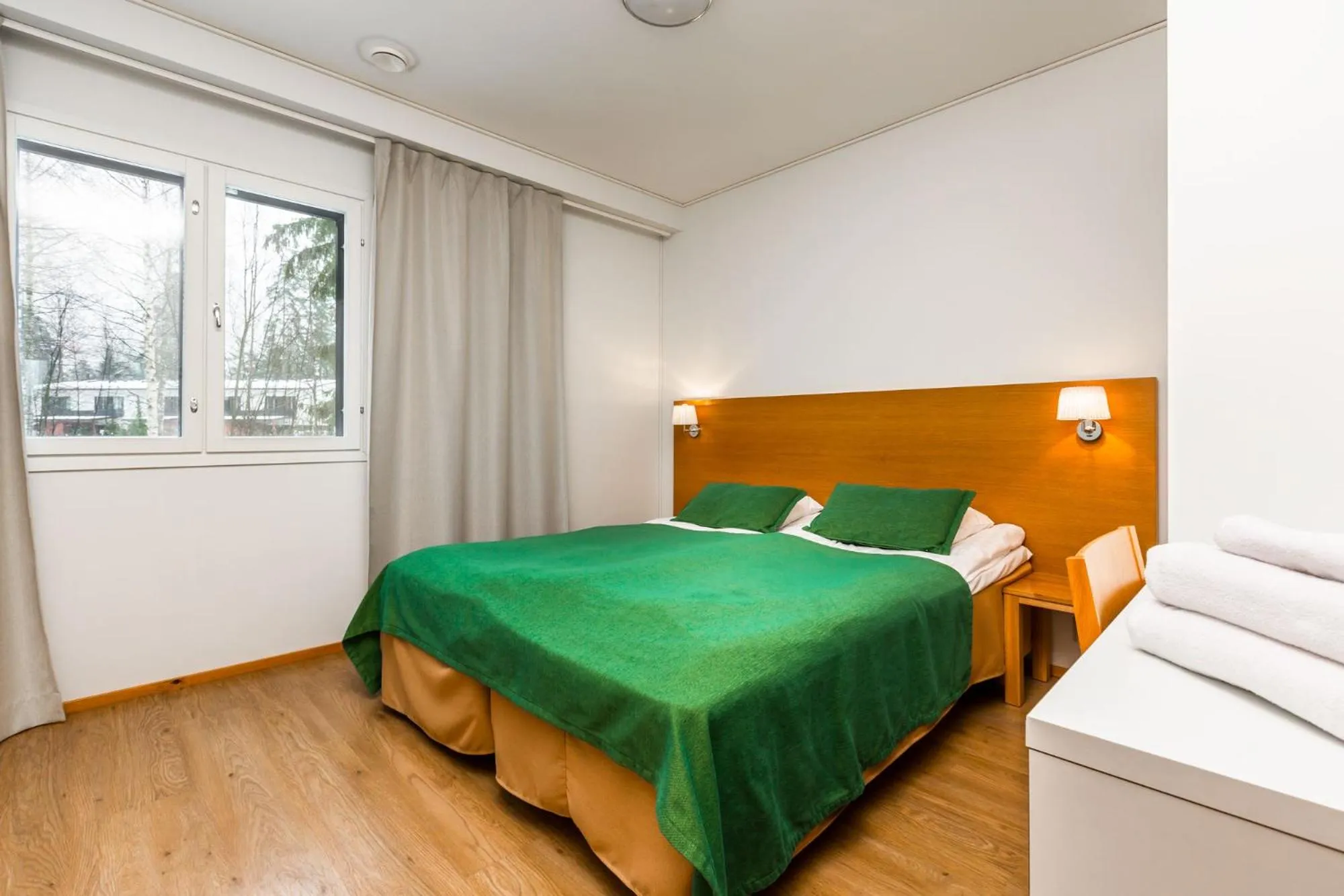 Bedroom, Bed in Imatran Kylpylä Spa Apartments