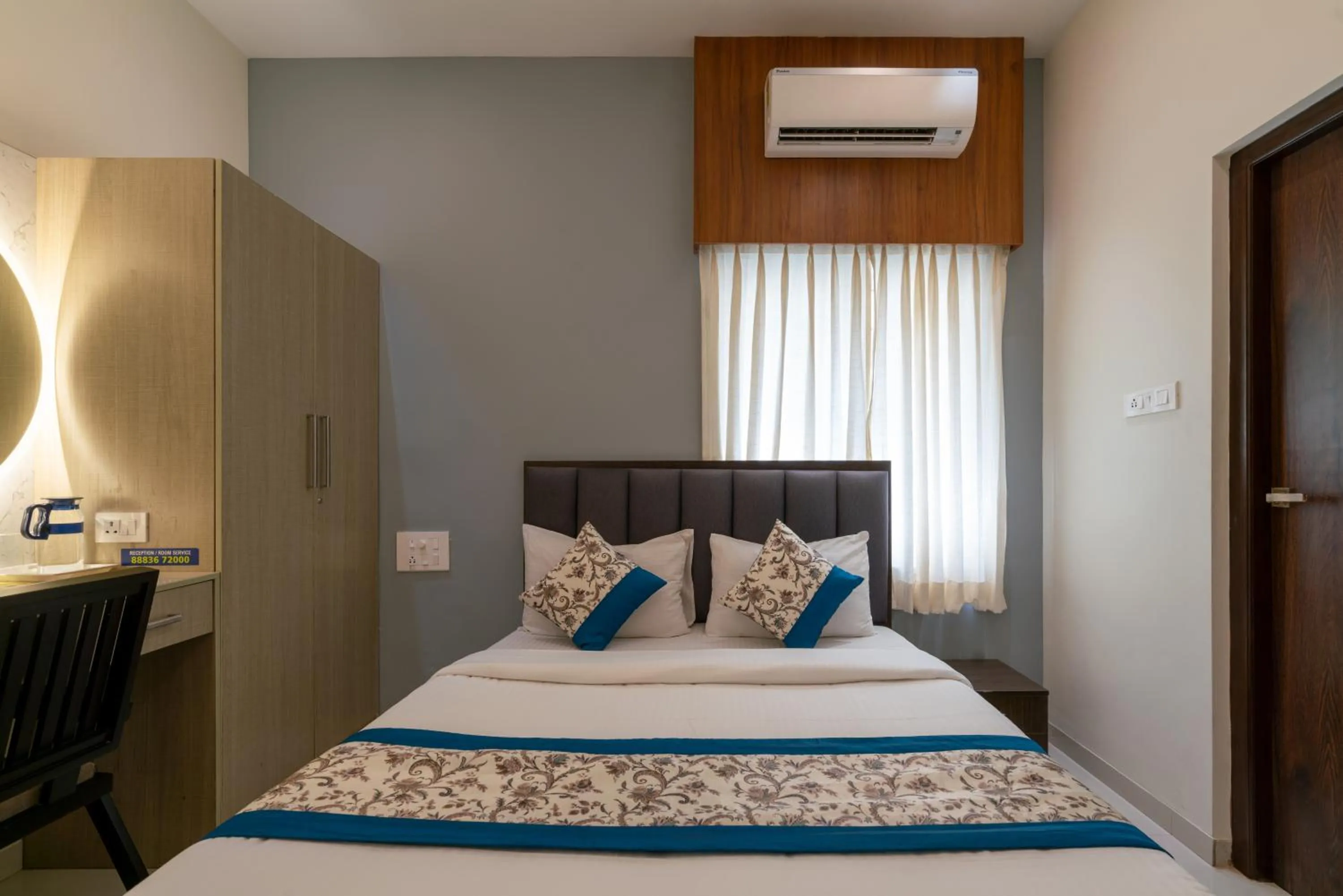 Bed in THE SURRYA MAX RESIDENCY