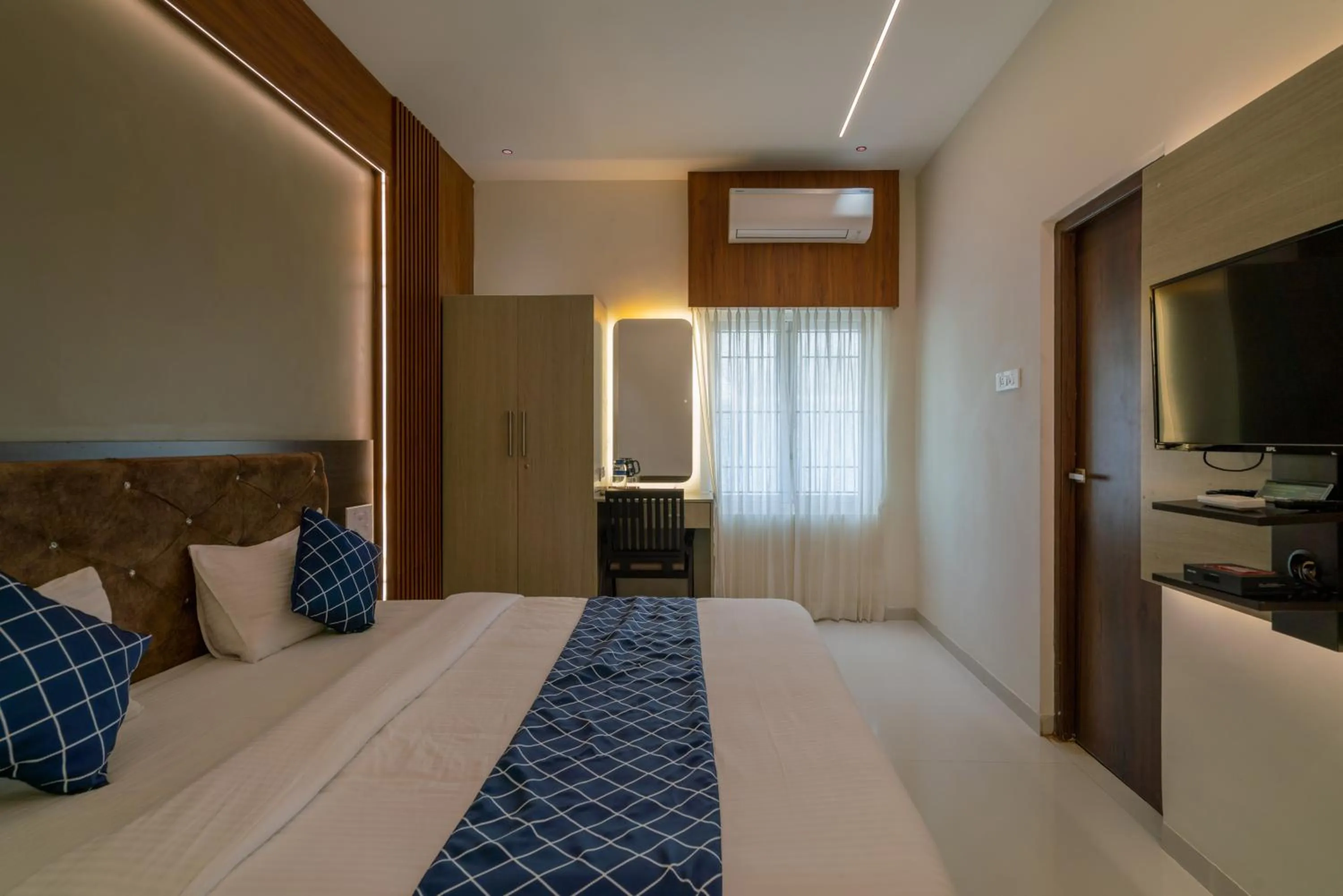 Bed in THE SURRYA MAX RESIDENCY