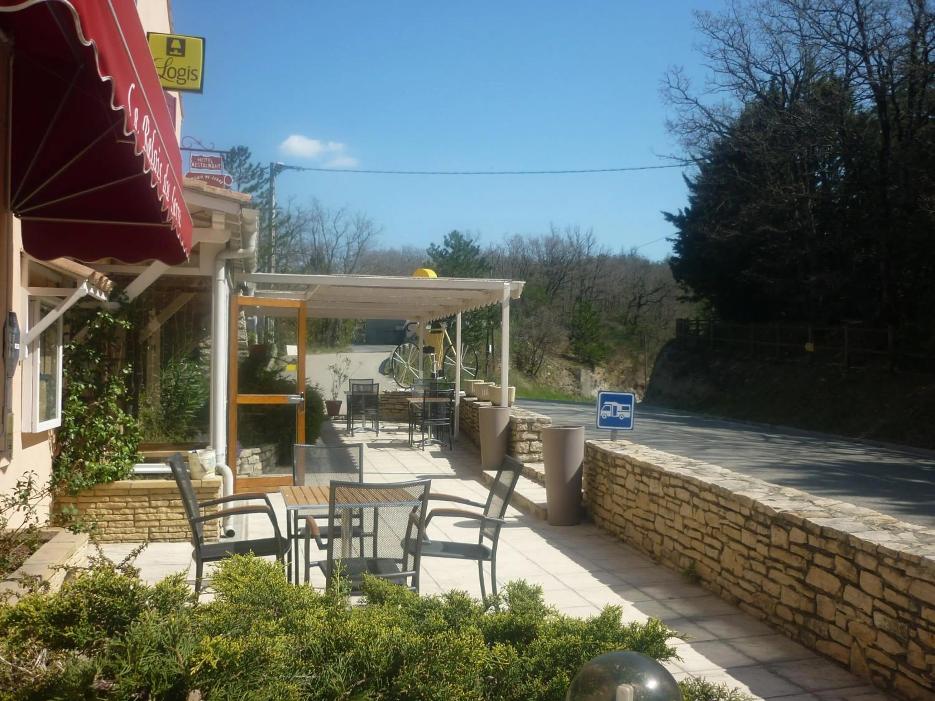 Patio in Logis Hotel Le Relais du Serre