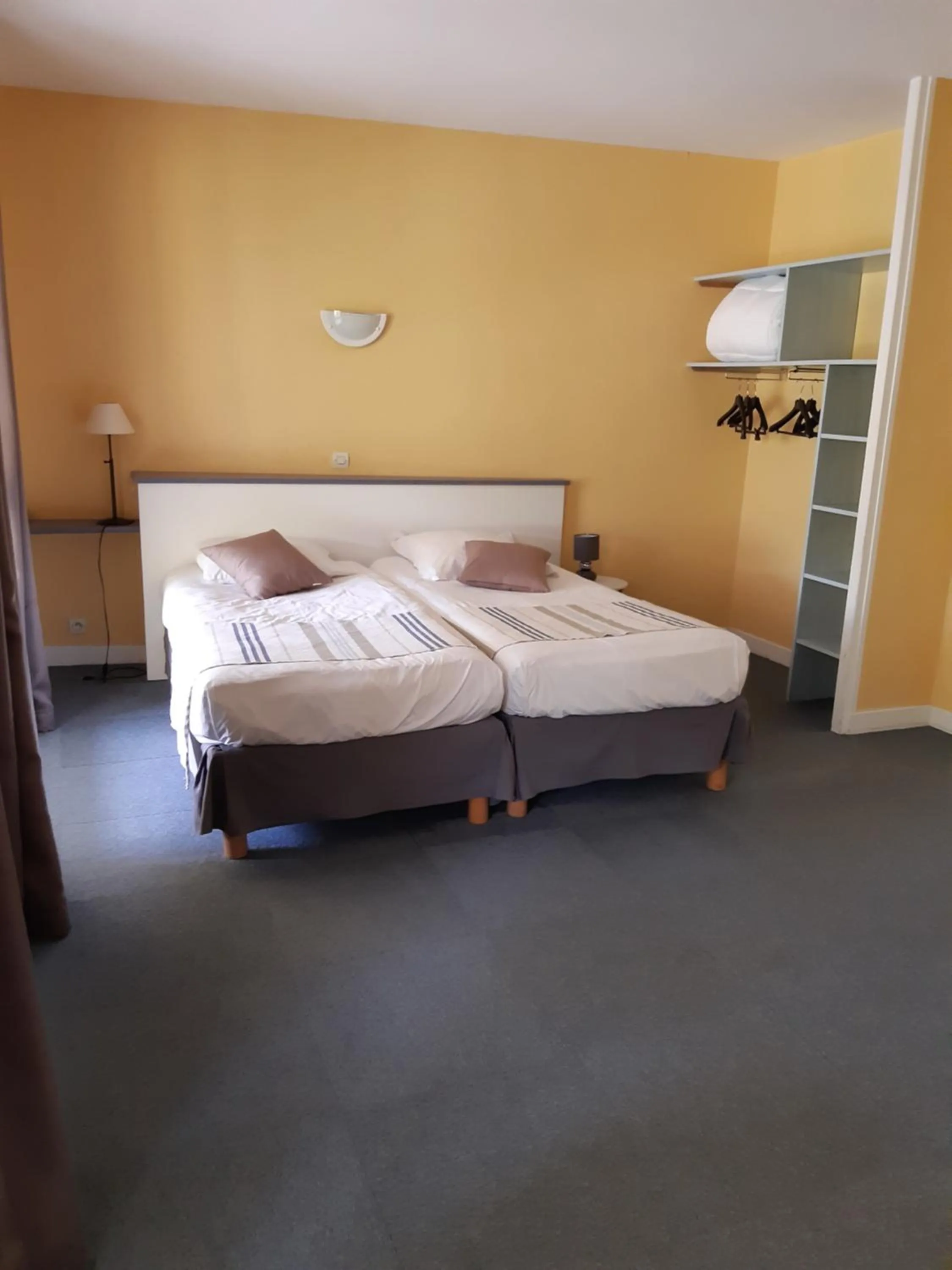 Bed in Logis Hotel Le Relais du Serre