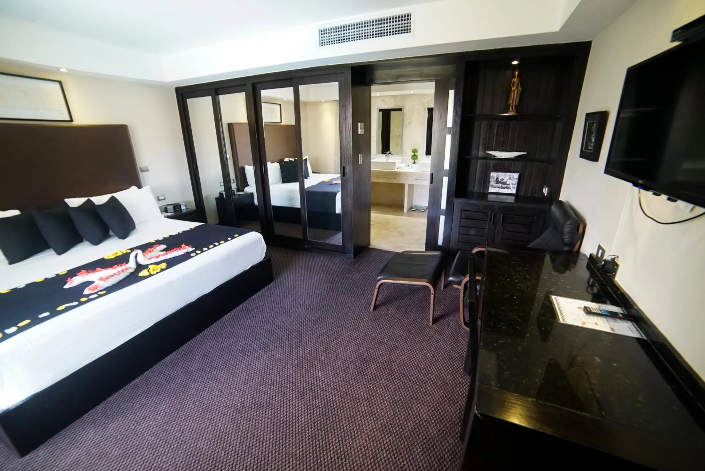 Bed in Savoy Hotel Boutique