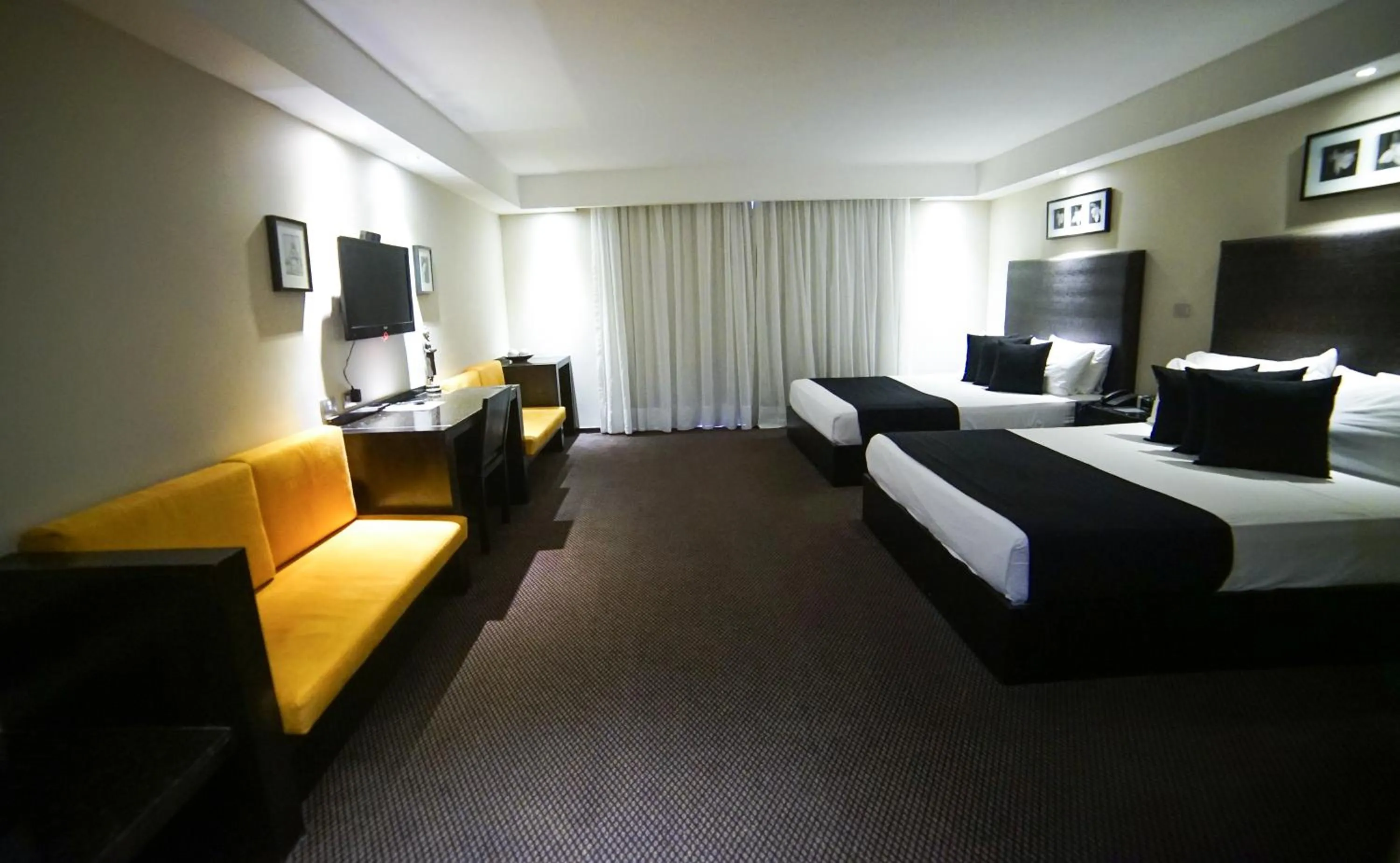 Bed in Savoy Hotel Boutique