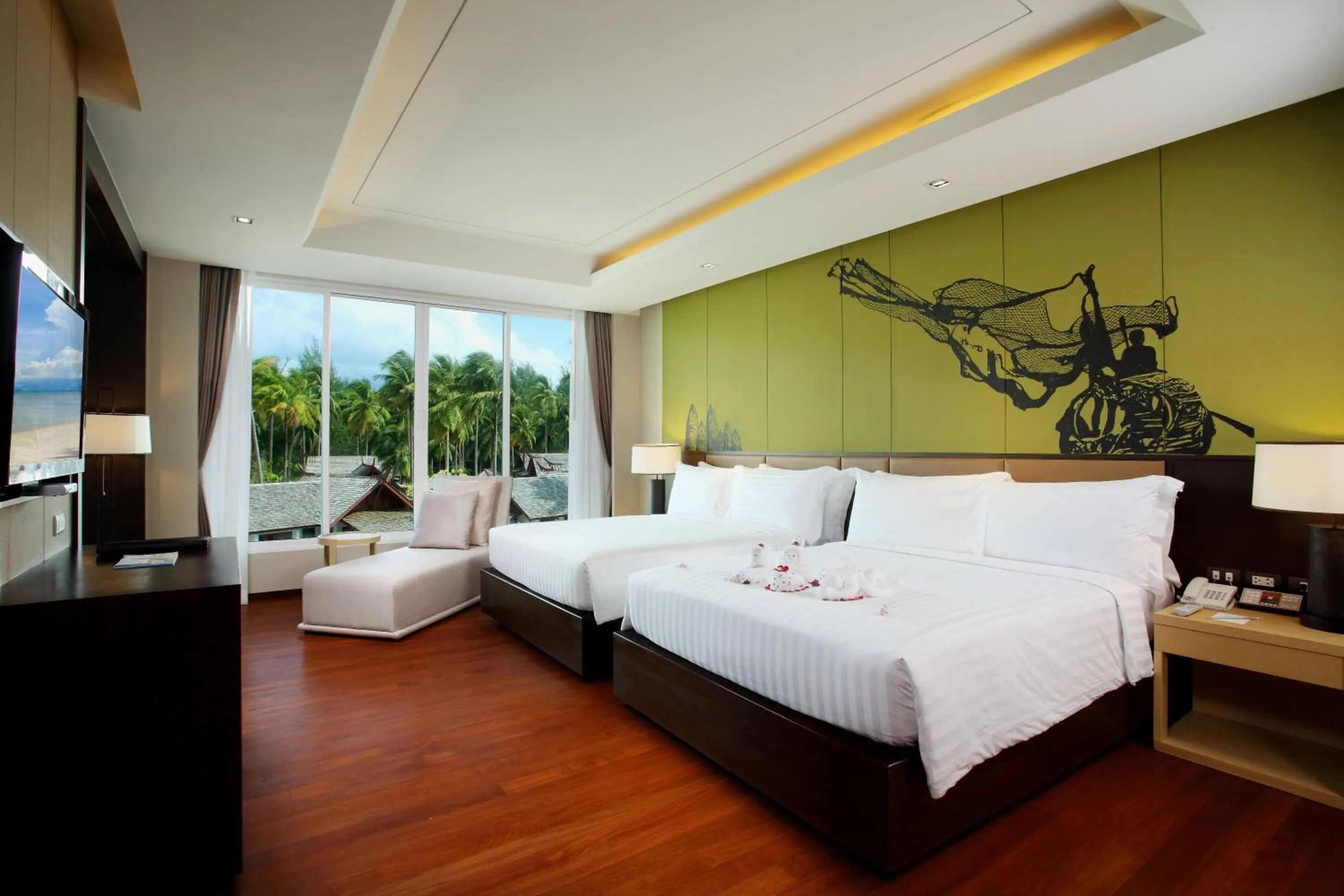 Bed in Graceland Khaolak Beachfront Resort