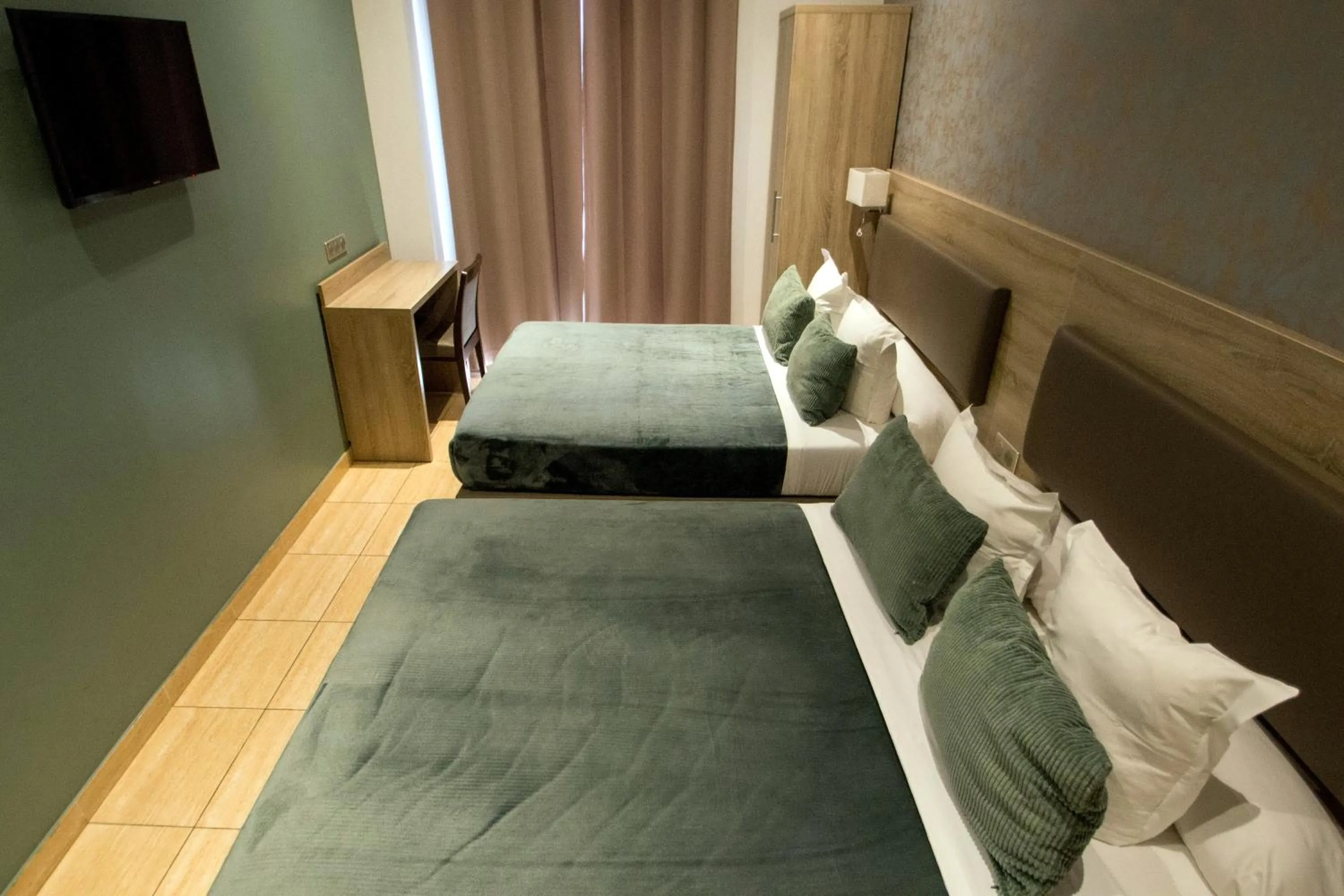 Bed in Hôtel Parisien