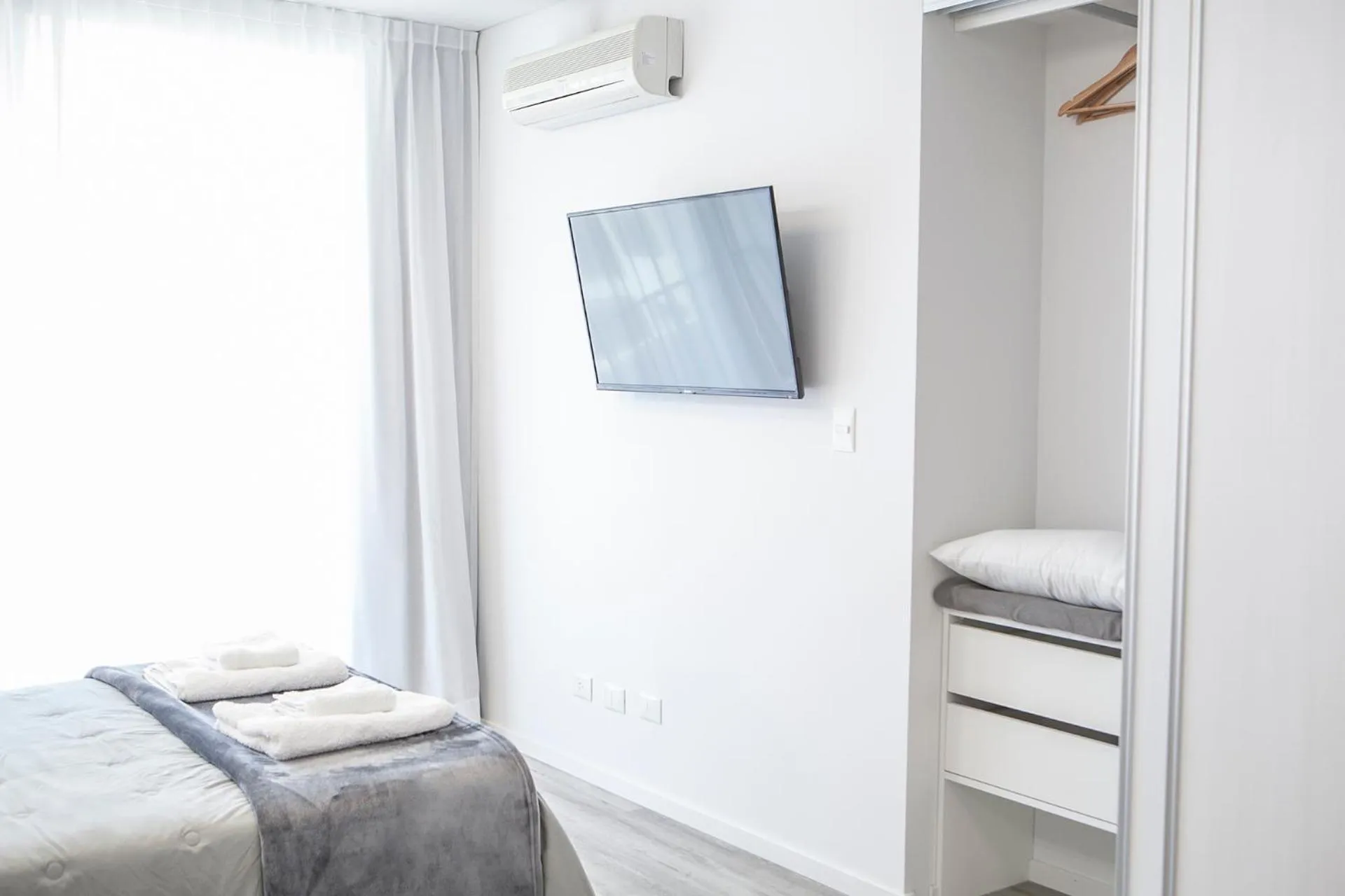 Bed in Monroe Suites