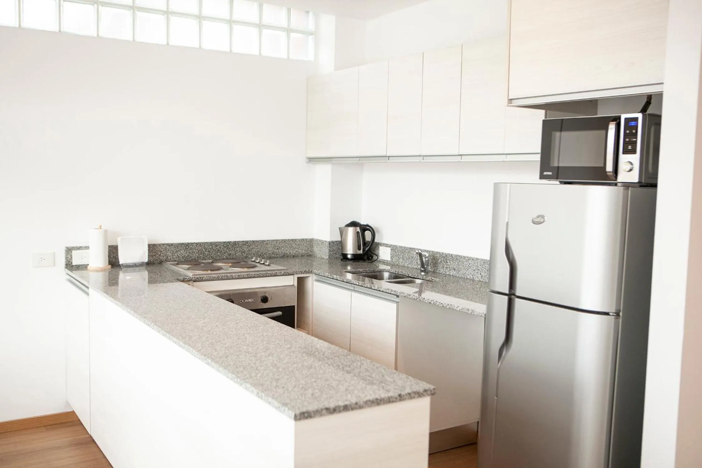 Kitchen or kitchenette in Monroe Suites