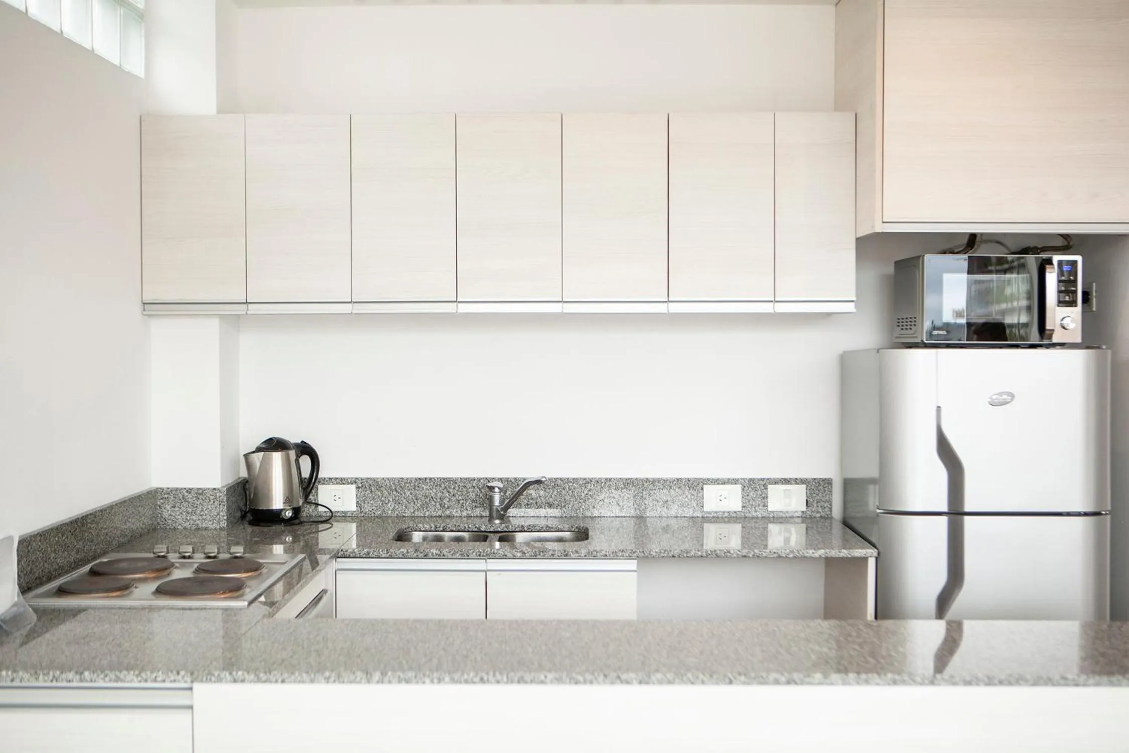 Kitchen or kitchenette in Monroe Suites