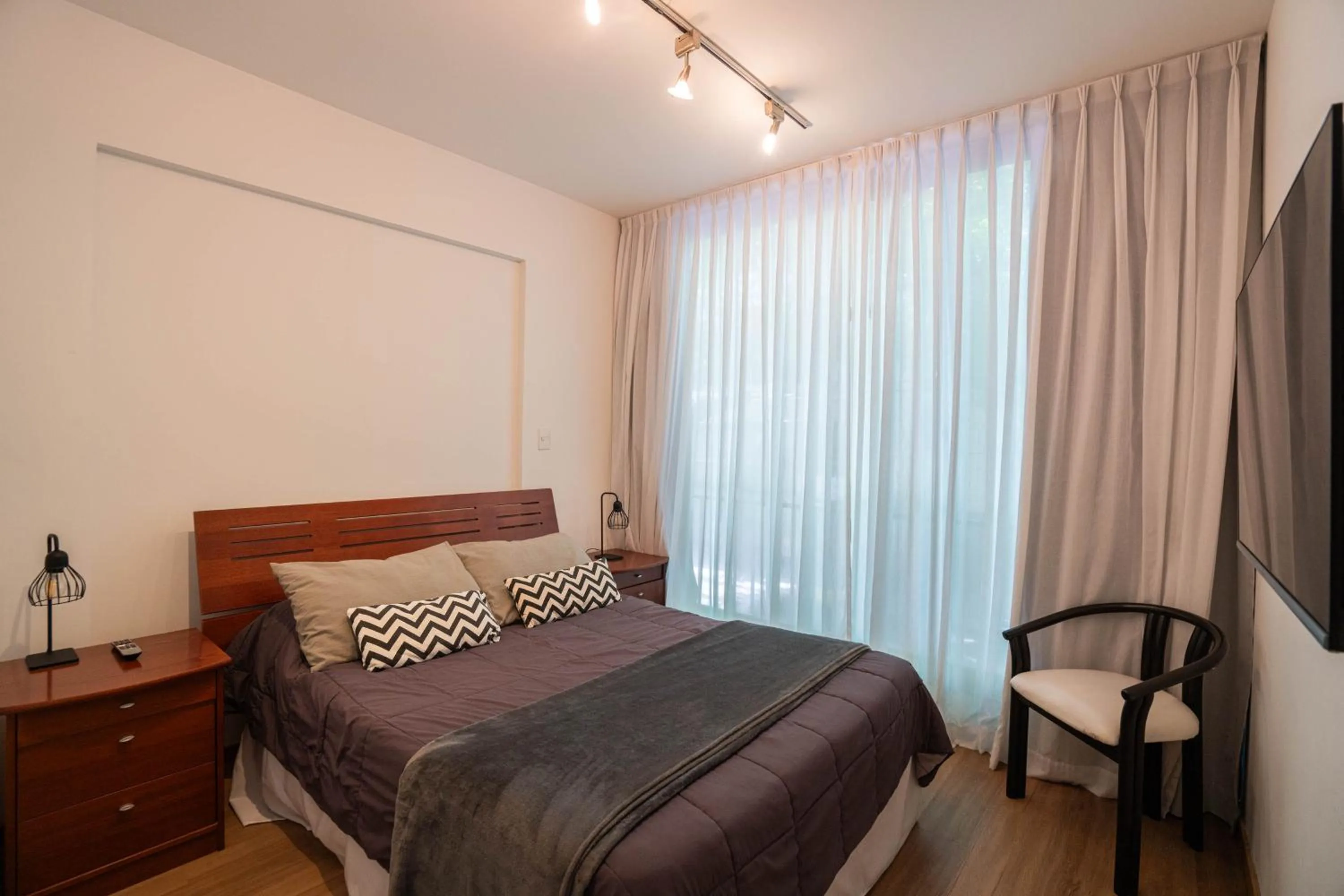 Bed in Monroe Suites