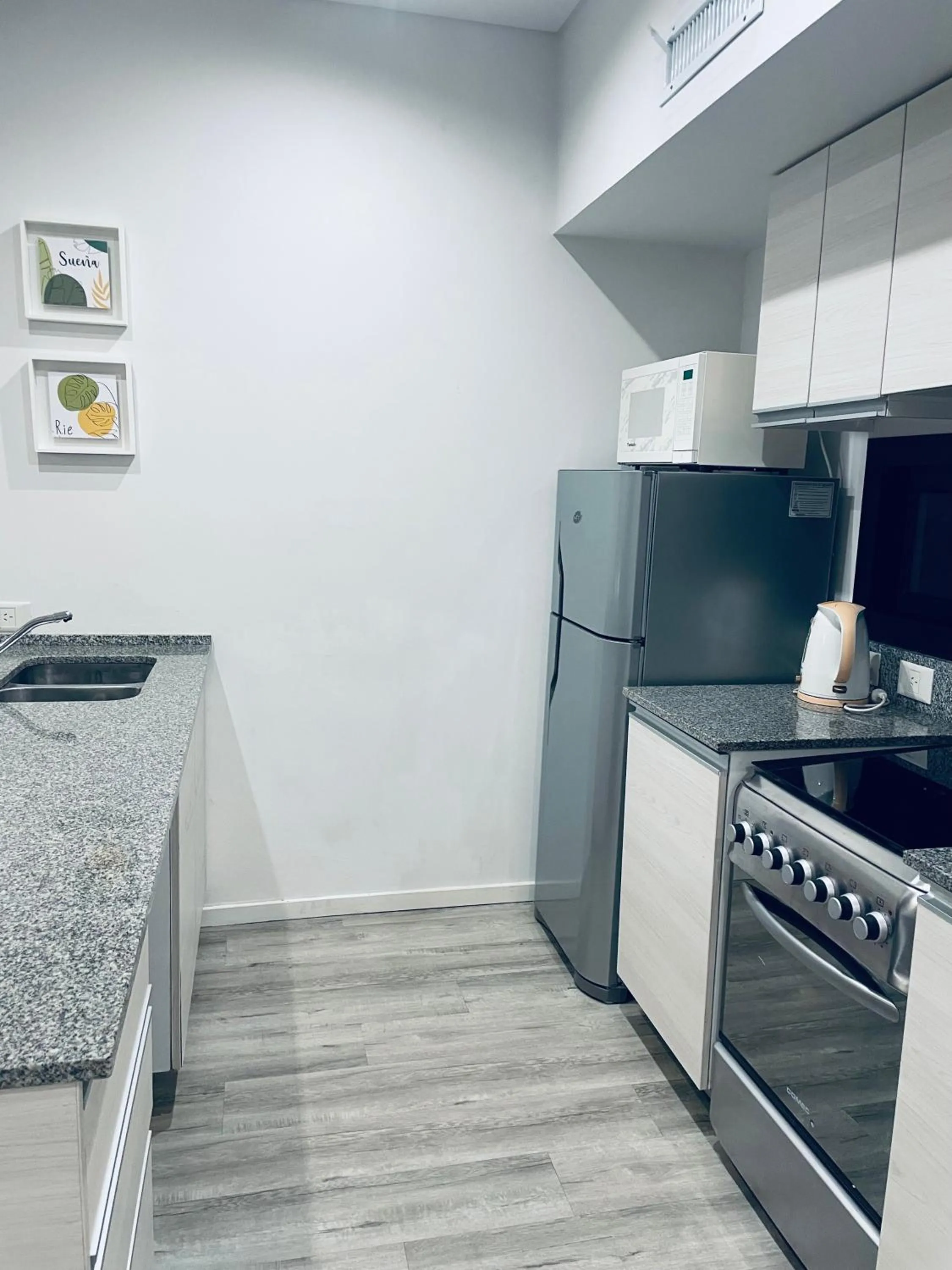 Kitchen or kitchenette in Monroe Suites