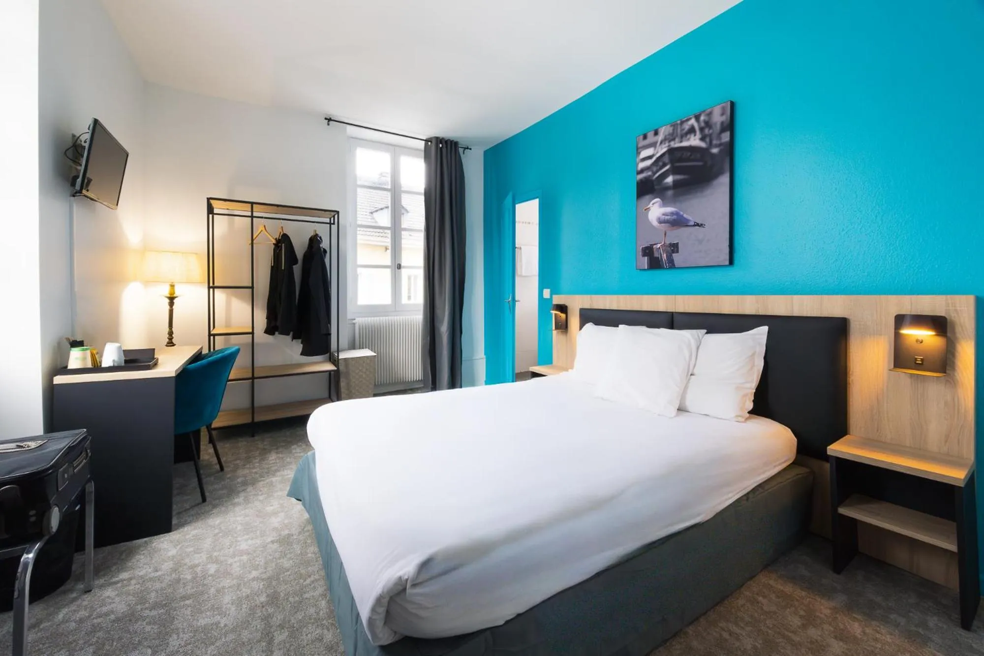 Bed in Hôtel de France - Le Patriarche