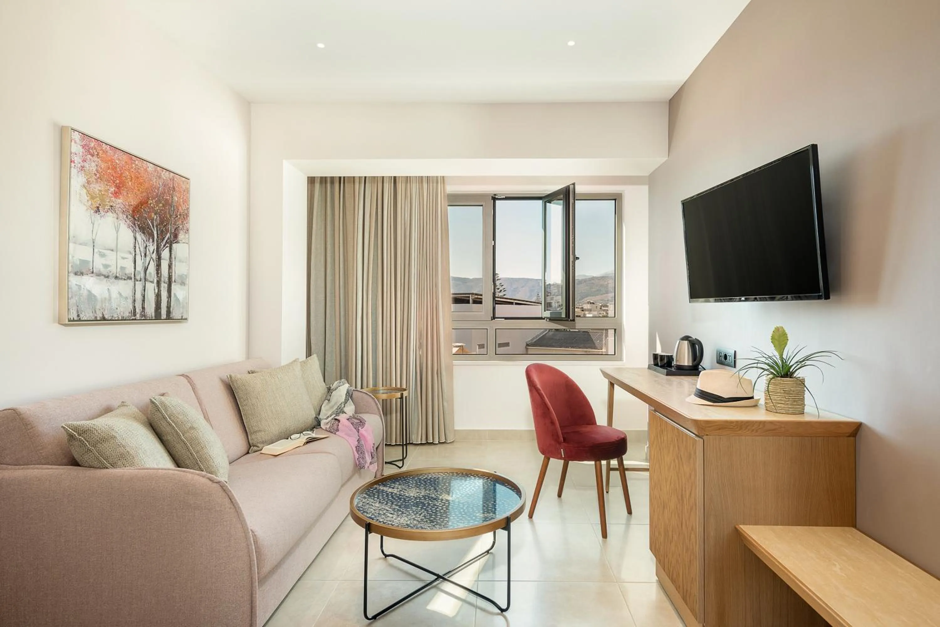 Communal lounge/ TV room in M City Hotel