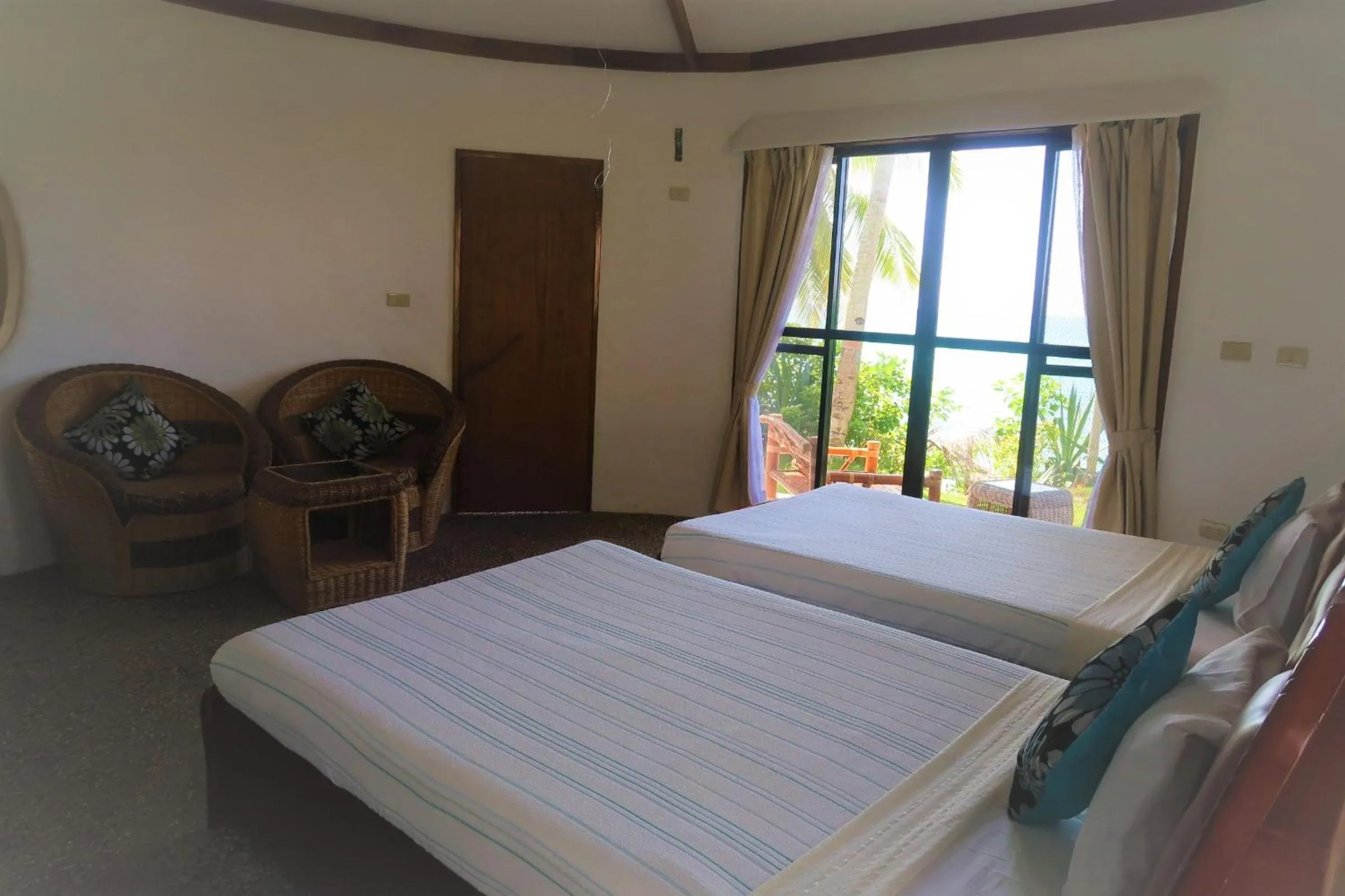 Bed in VILLA MARMARINE BEACH RESORT & RESTAURANT