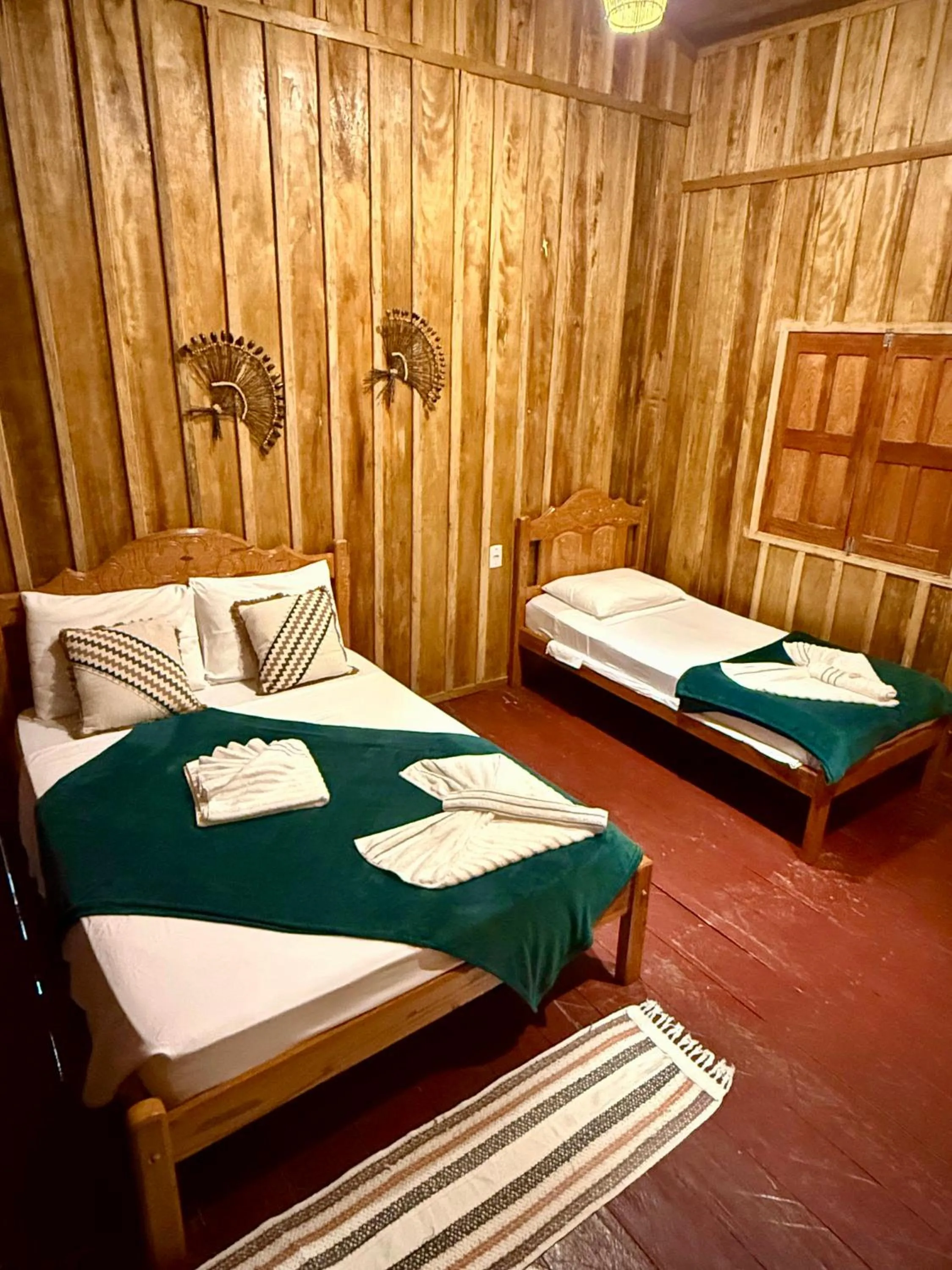 Bed in Vista do Lago Jungle Lodge