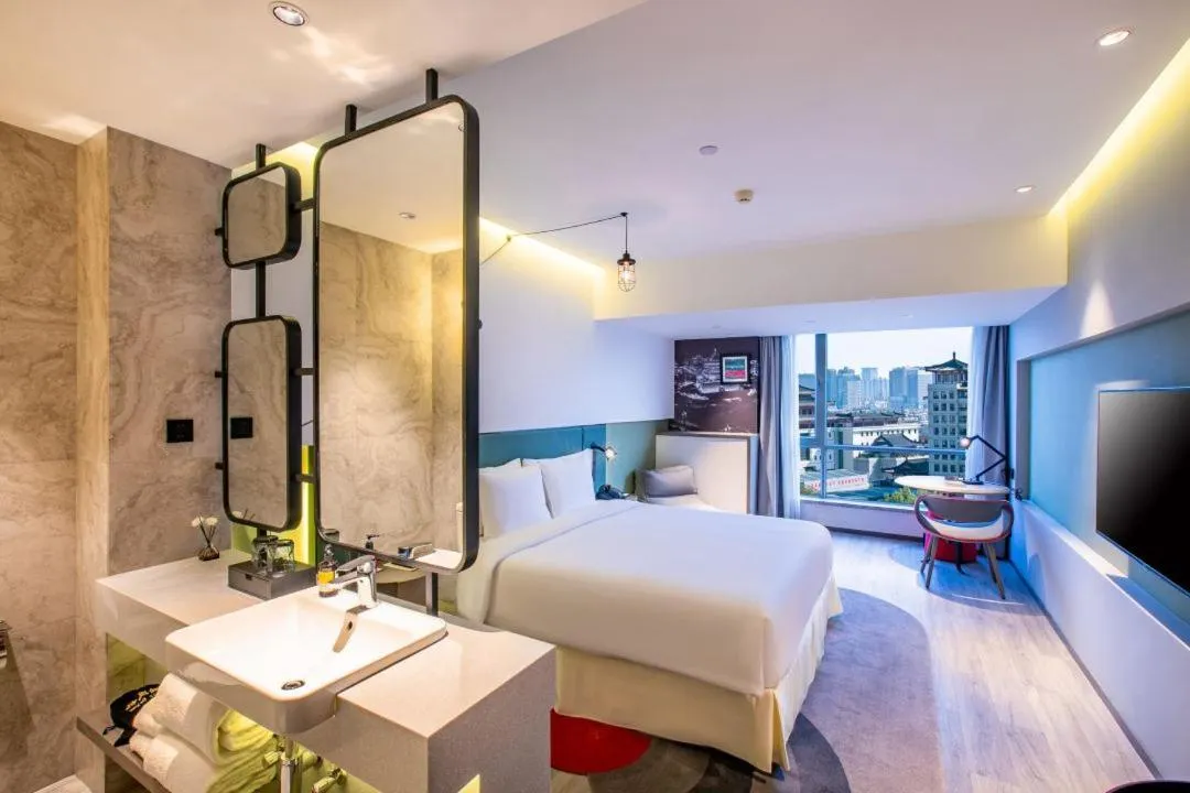 Bed in Jinmao Hotel Xi'an Downtown ( Bell & Drum Tower)