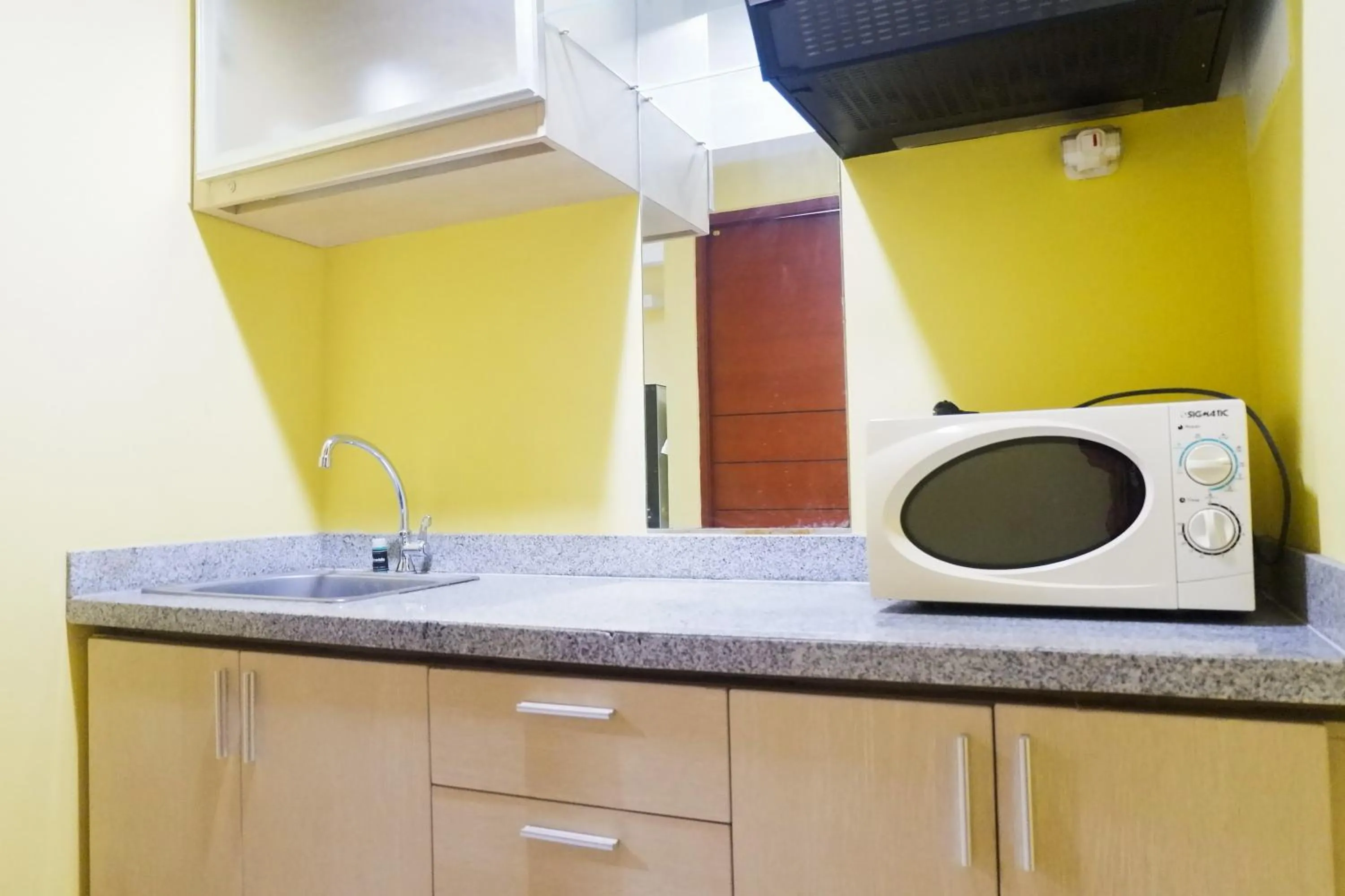 Kitchen or kitchenette in Comfy Studio at High Point Serviced Apartment By Travelio