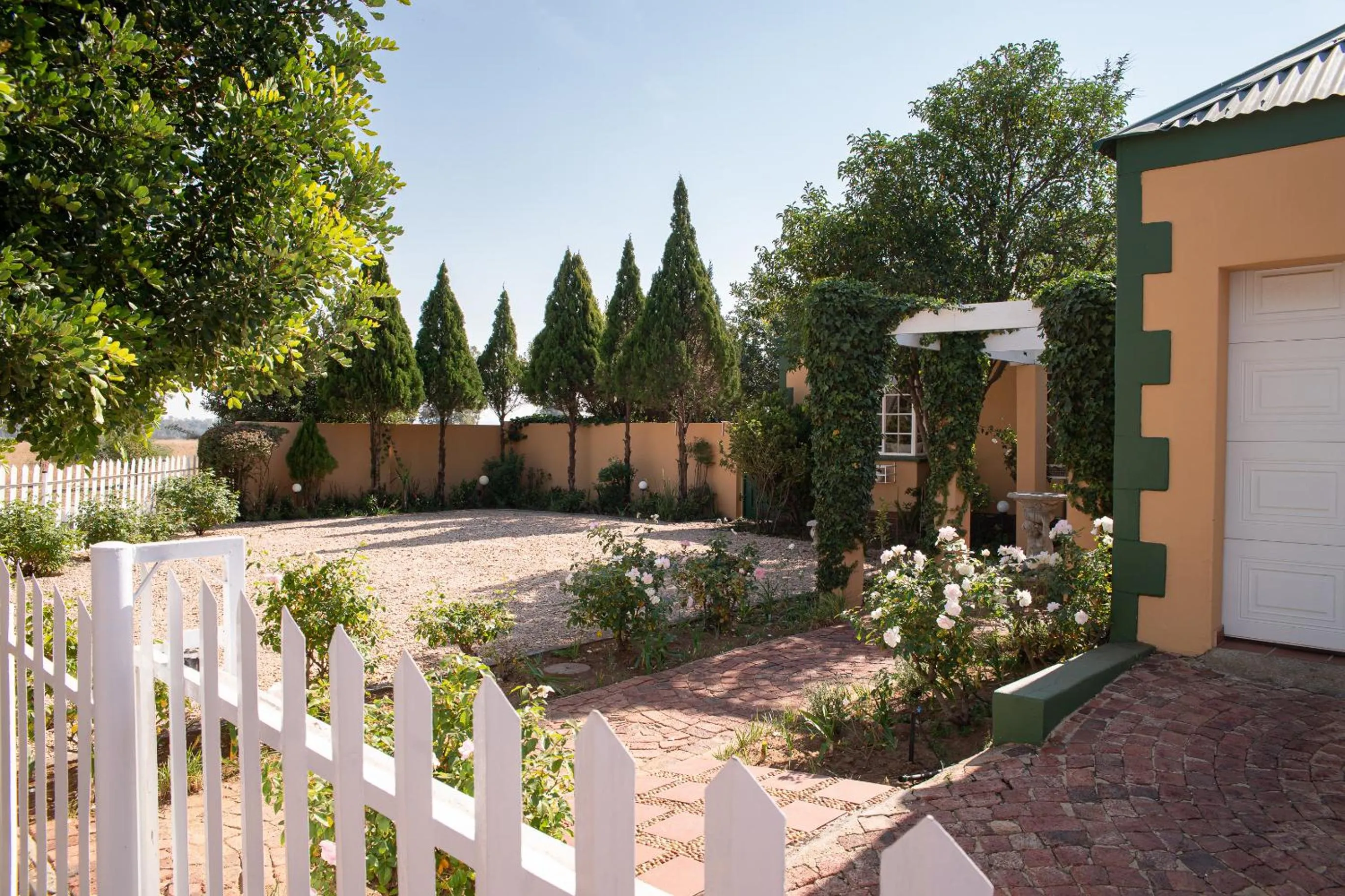 Garden in Roses and Pebbles B & B Guest House