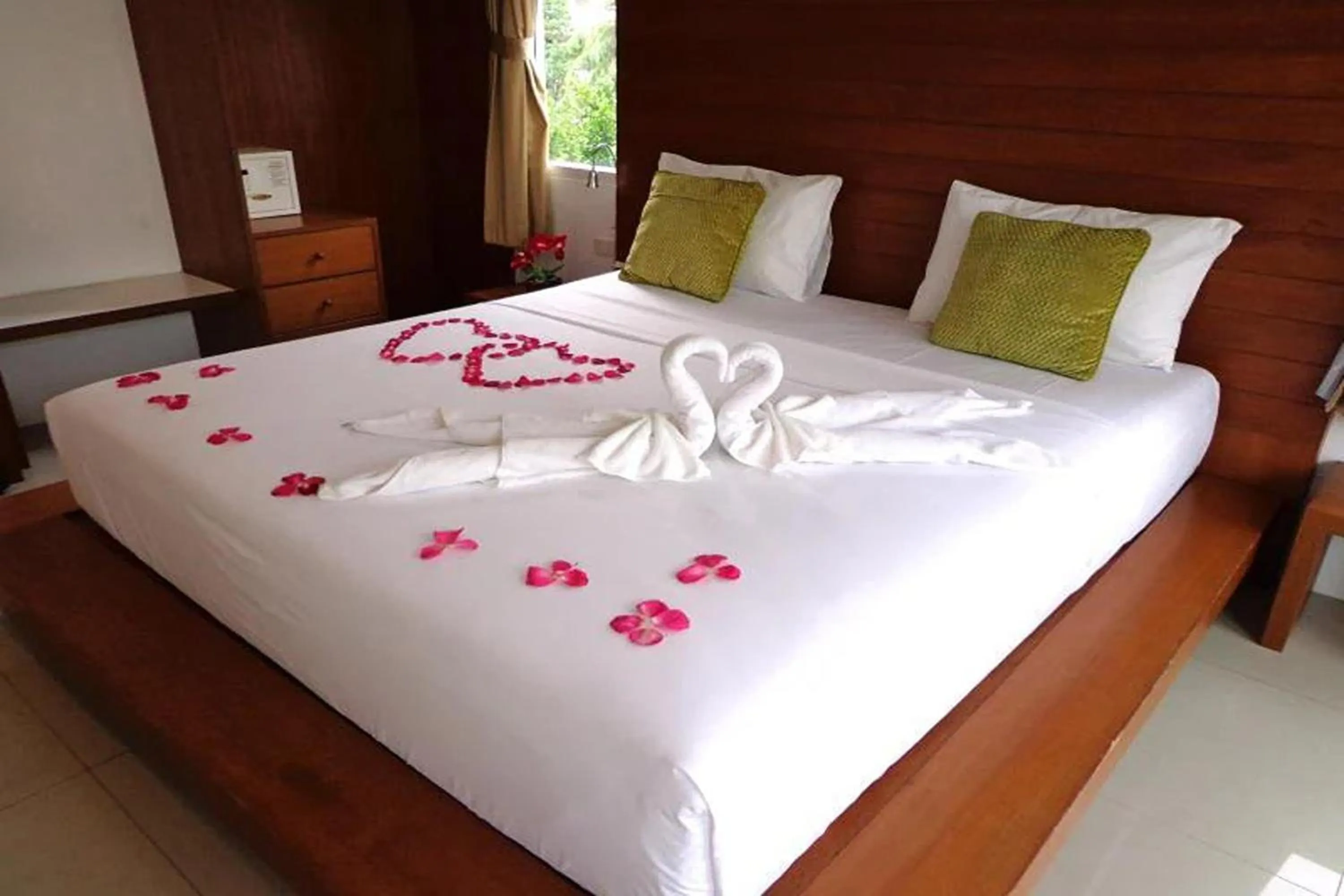 Bed in Sukcheewa Residence Phuket