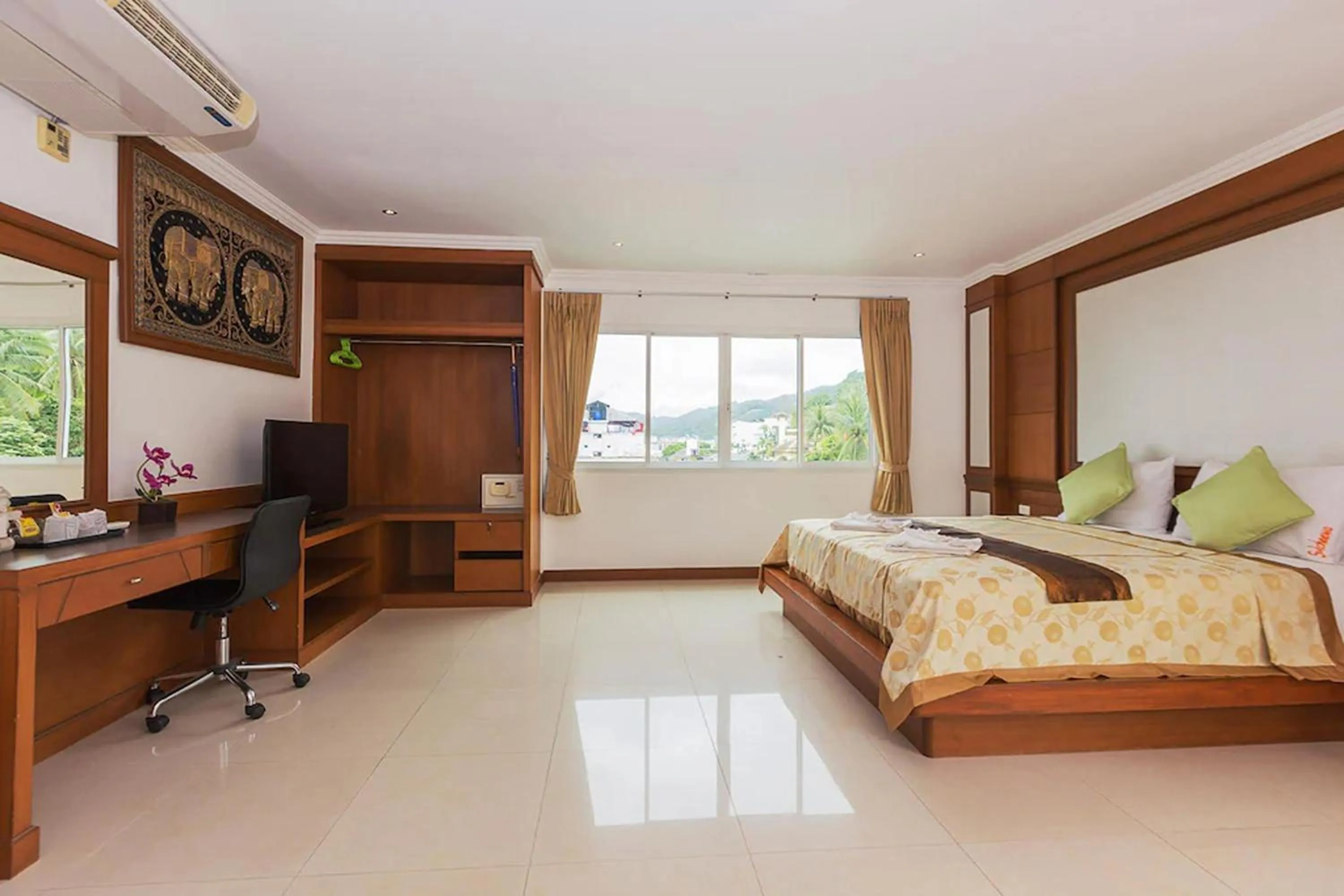 Bed in Sukcheewa Residence Phuket