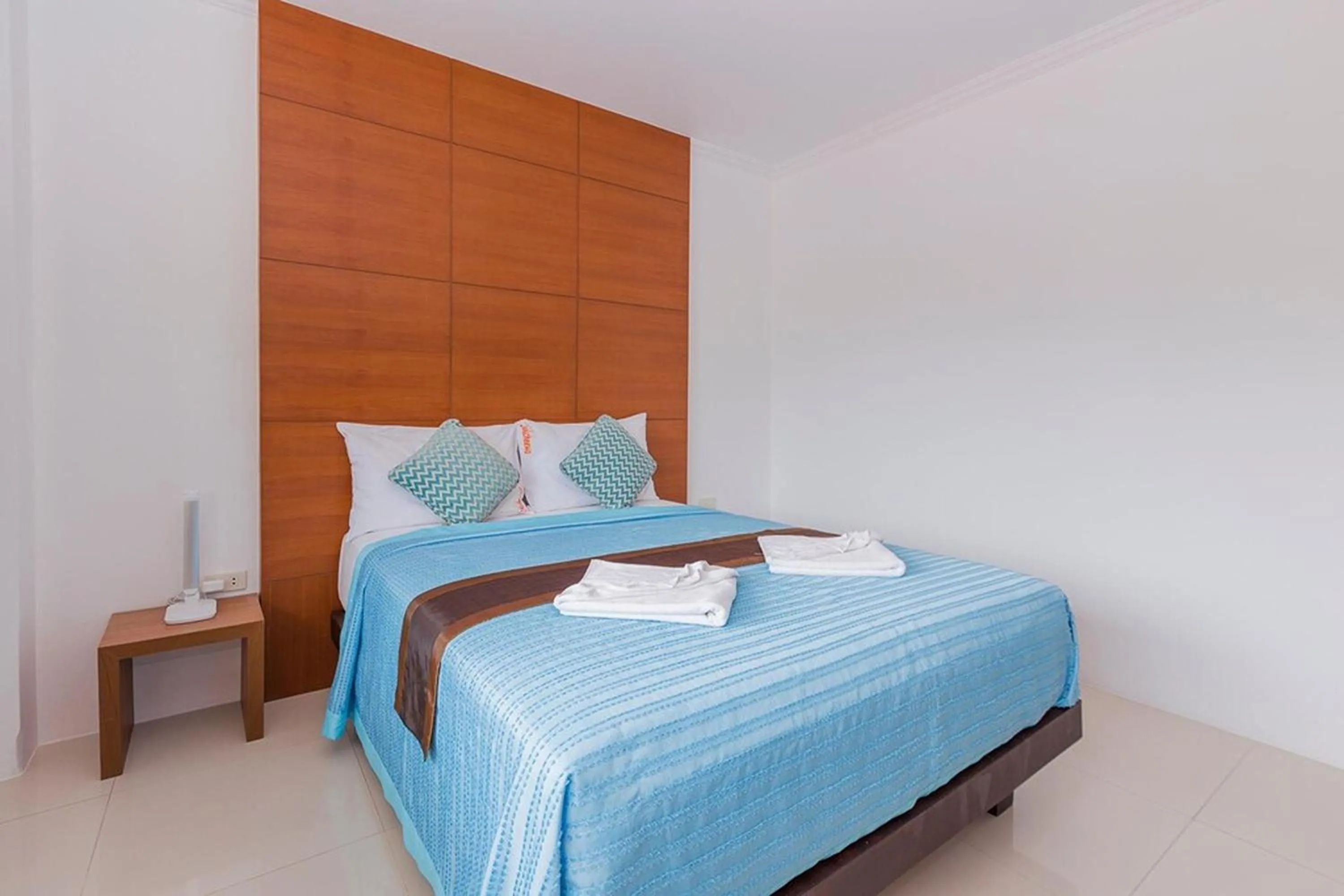 Bed in Sukcheewa Residence Phuket