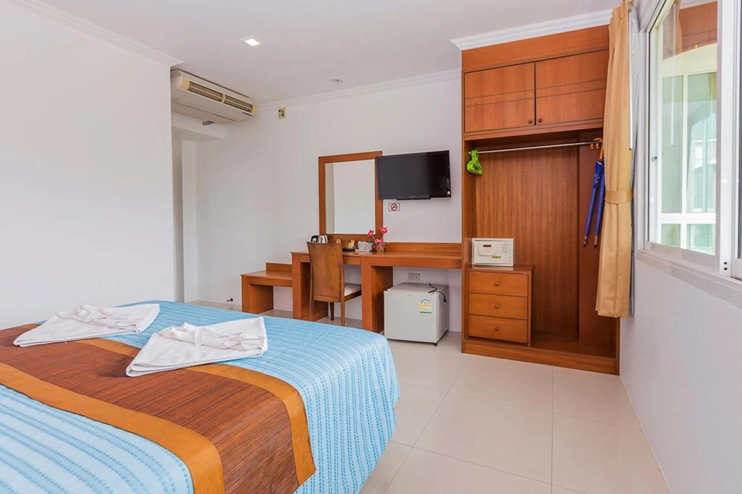 Bed in Sukcheewa Residence Phuket