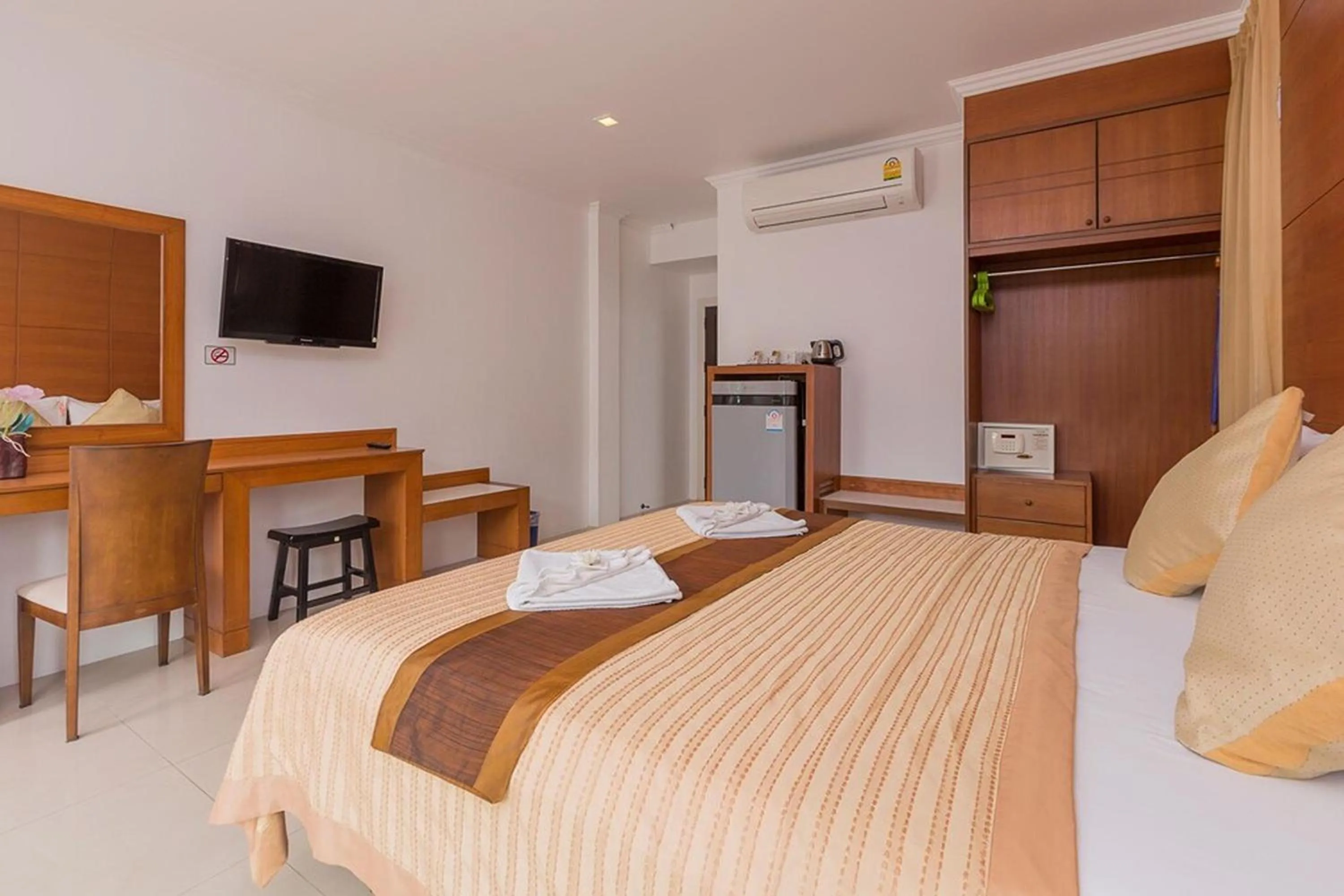 Bed in Sukcheewa Residence Phuket