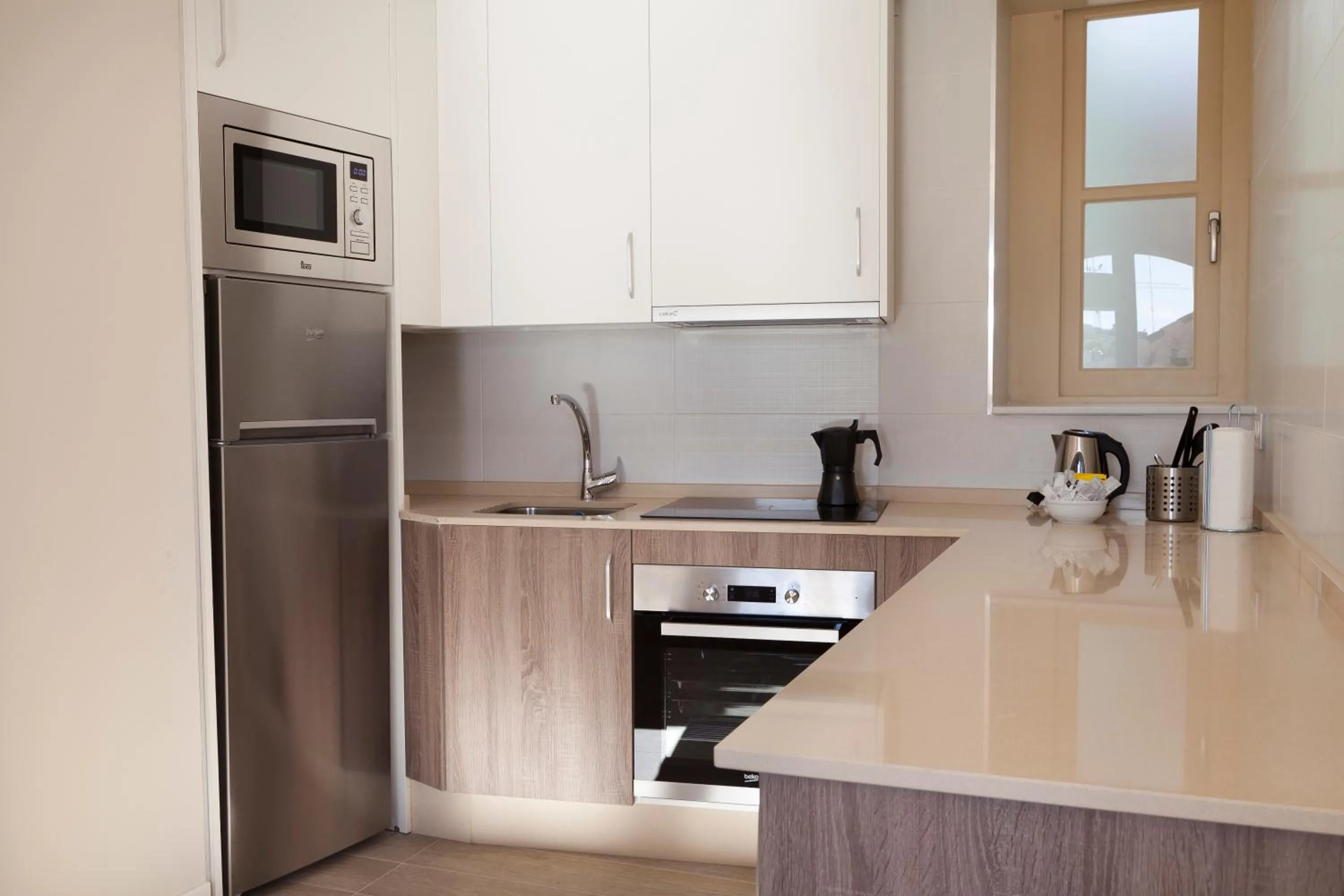 Kitchen or kitchenette in Apartamentos Pinar Malaga Centro