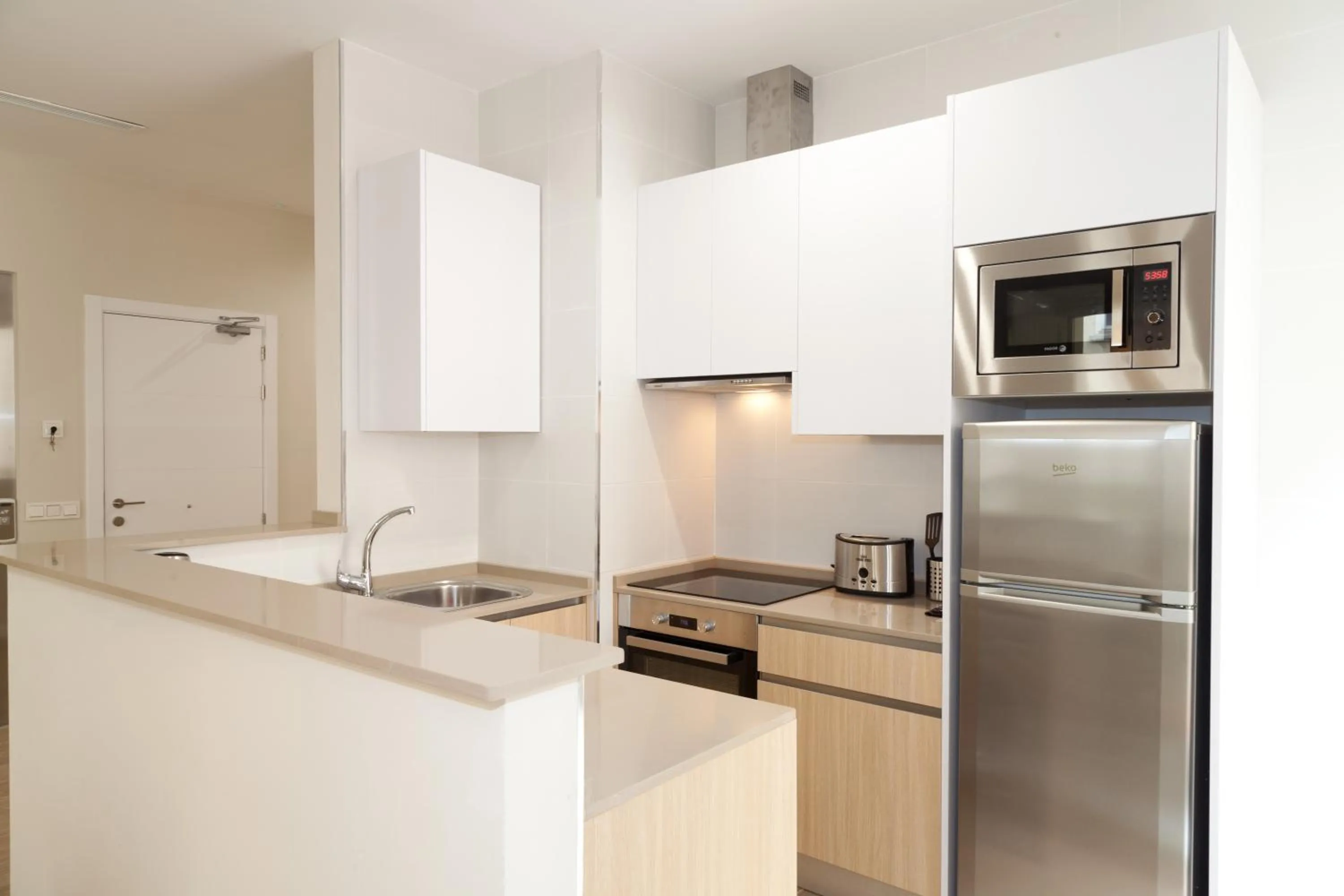 Kitchen or kitchenette in Apartamentos Pinar Malaga Centro