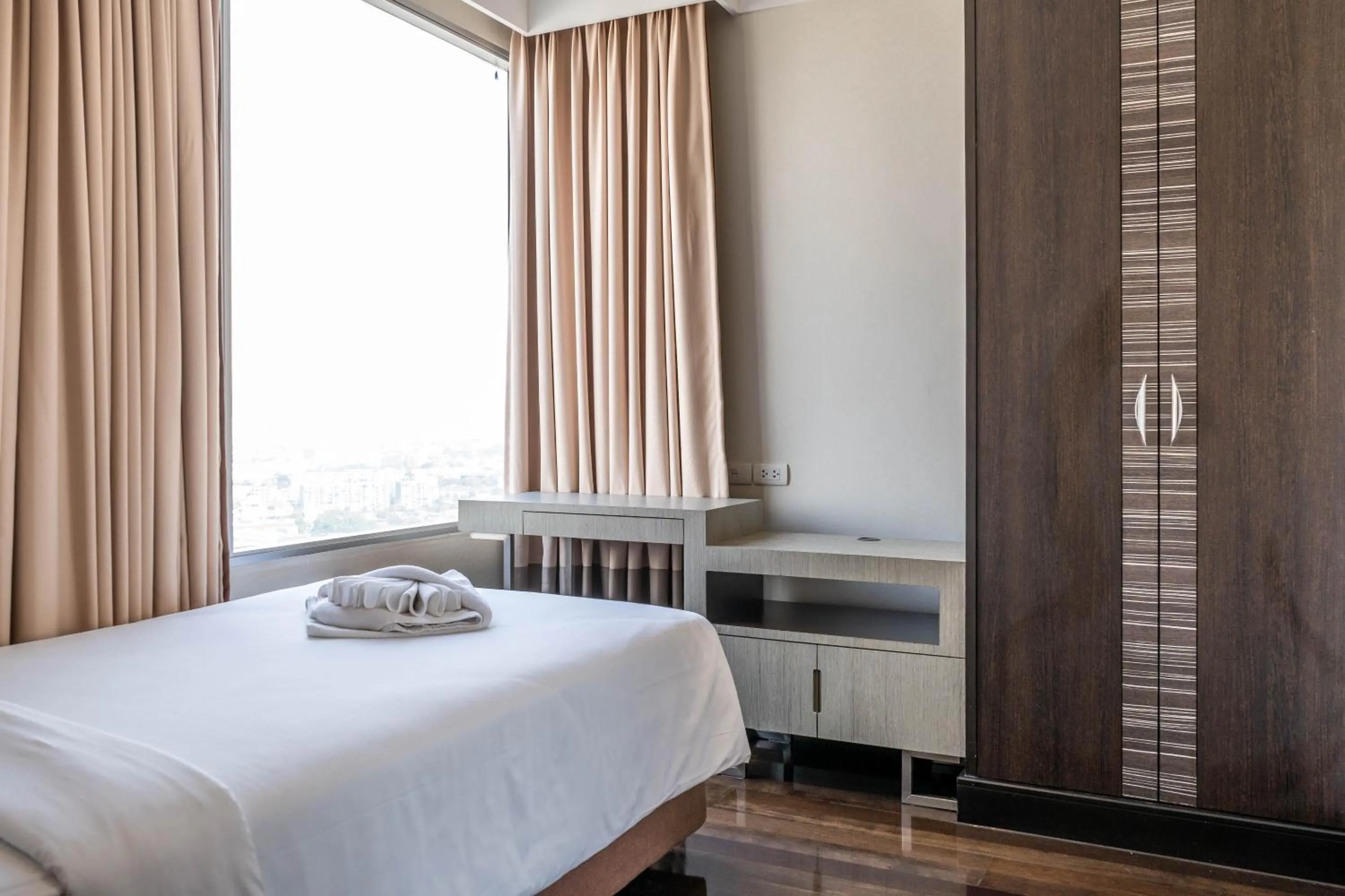 Bed in Jasmine Grande Residence