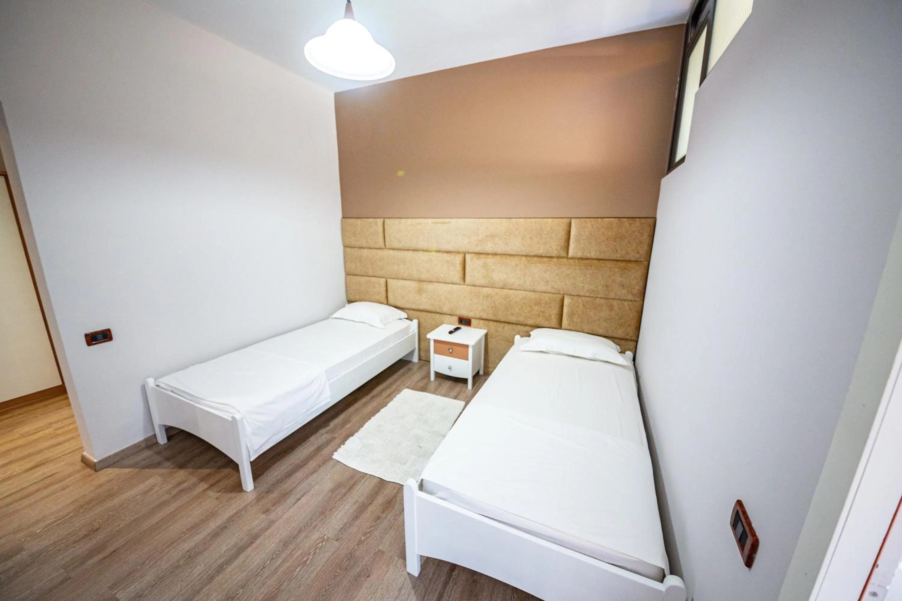 Bed in New Heaven Hotel