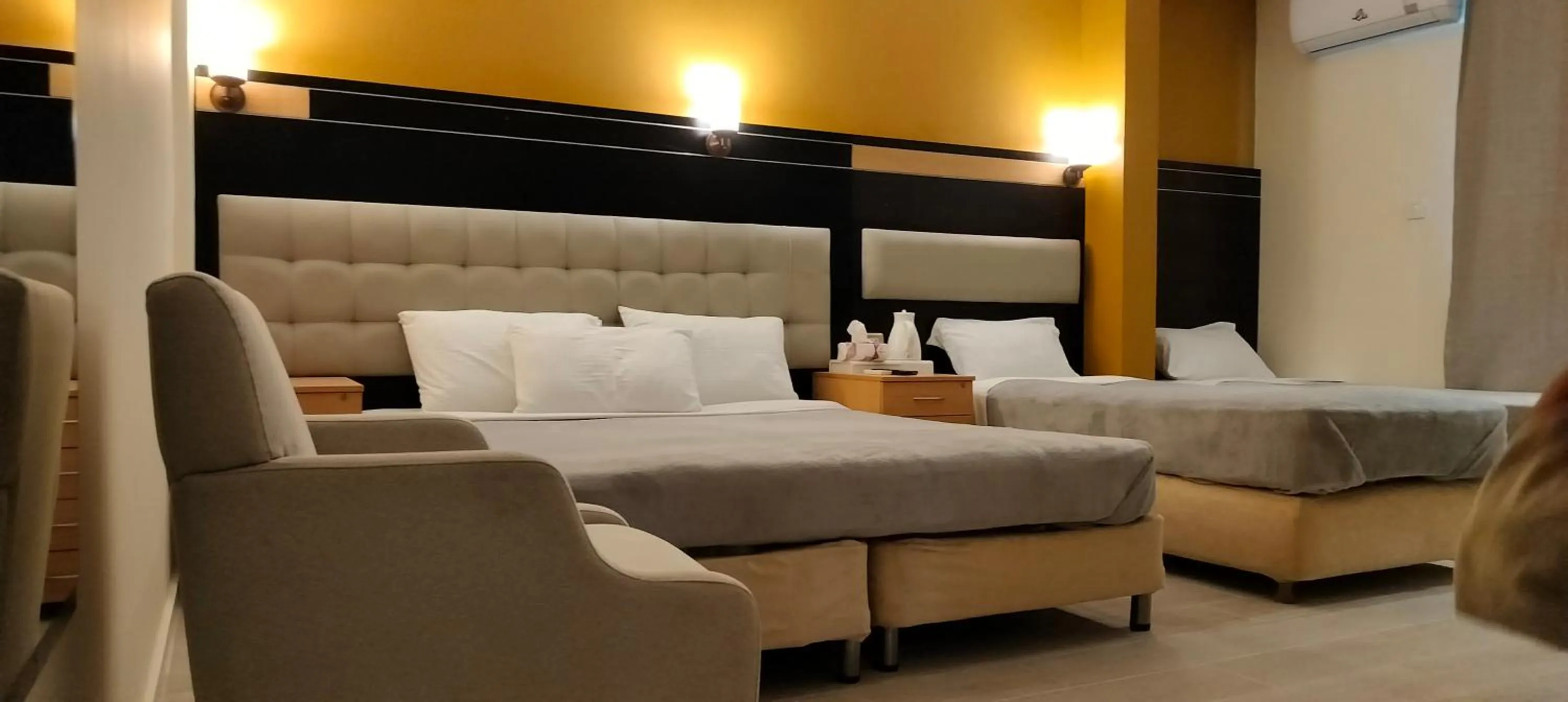 Living room, Bed in Petra Town Check-Inn