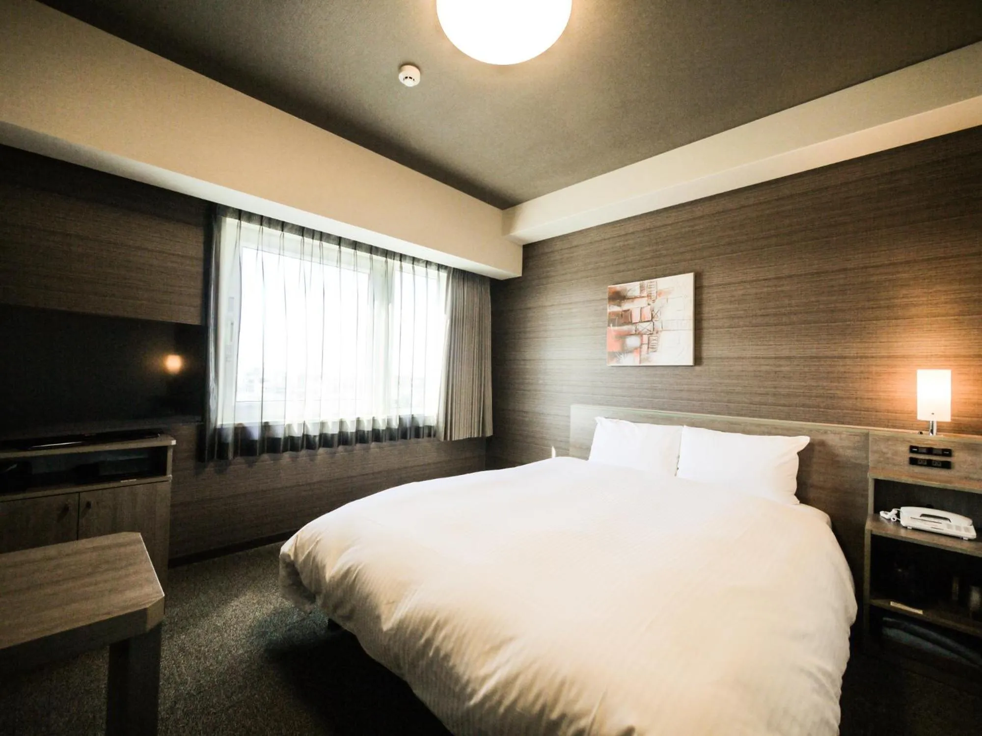 Photo of the whole room, Bed in Hotel Route-Inn Osaka Kishiwada -Higashikishiwada Ekimae Kansai Airport-