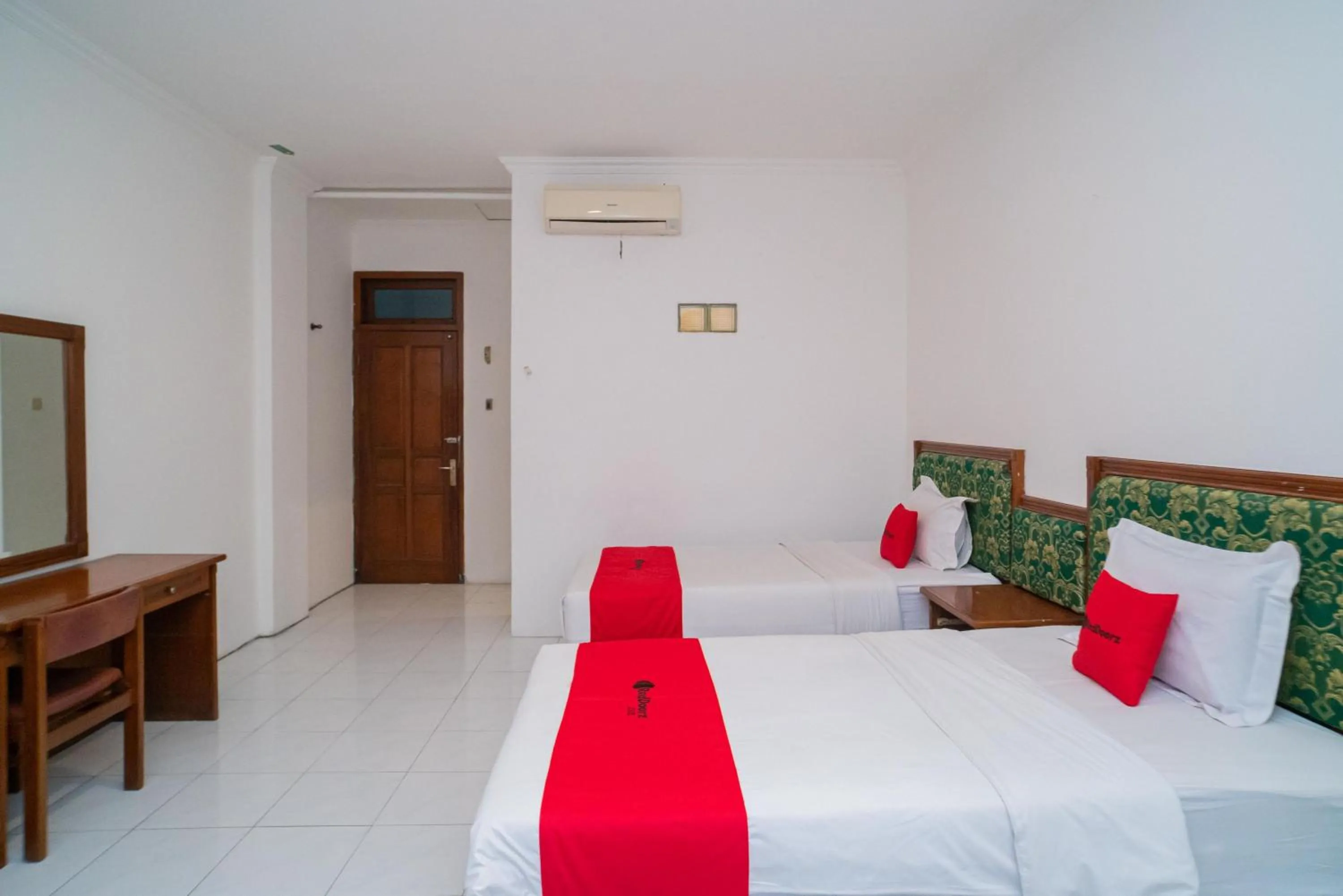 Bedroom, Bed in RedDoorz Plus at Hotel Surya Solo