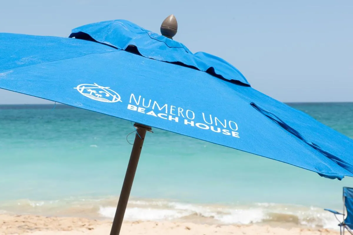 Property logo or sign in Numero Uno Beach House