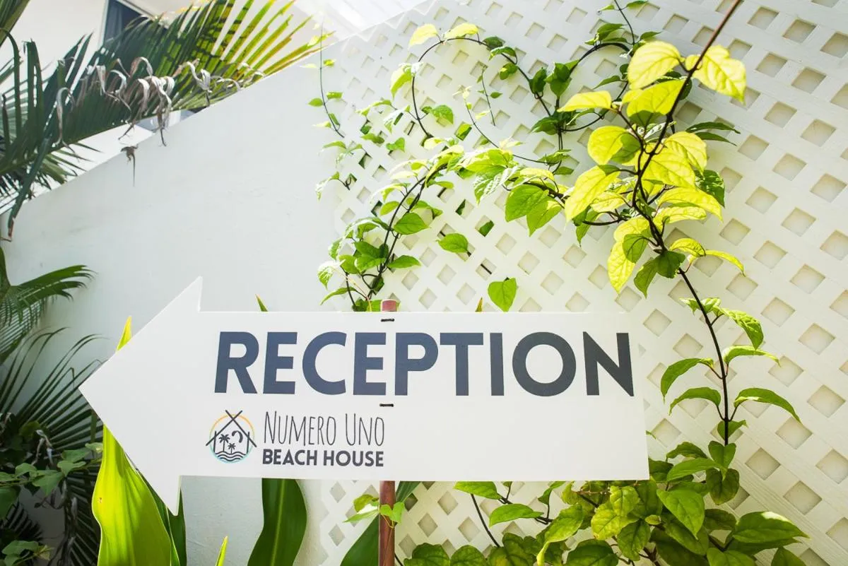Property logo or sign in Numero Uno Beach House