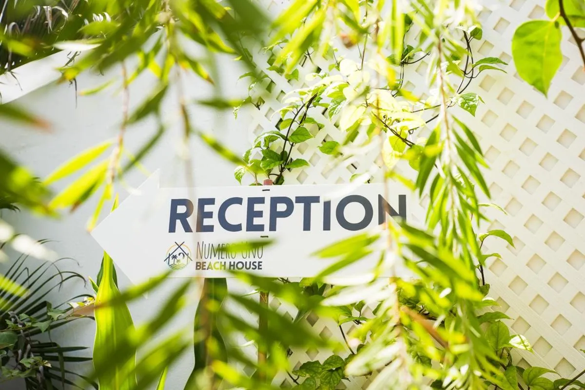 Property logo or sign in Numero Uno Beach House