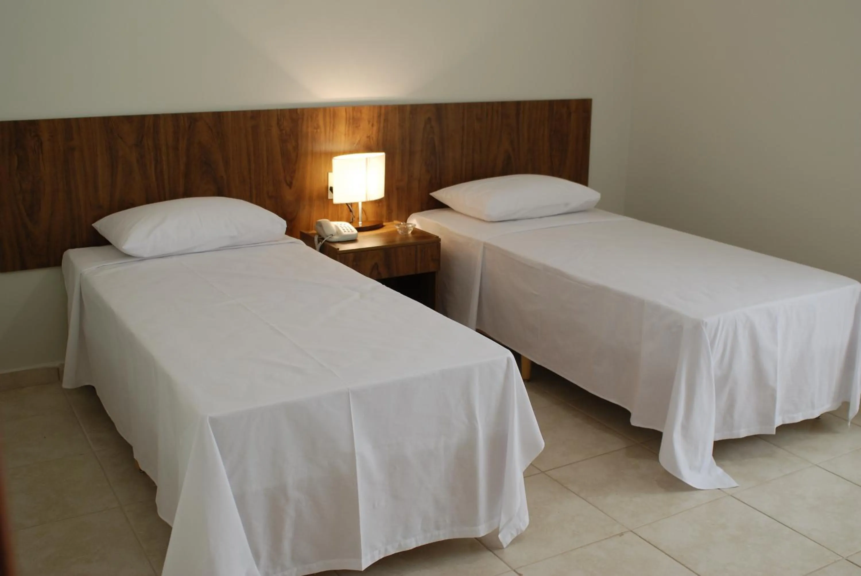 Bed in Monte Castro Executive Hotel