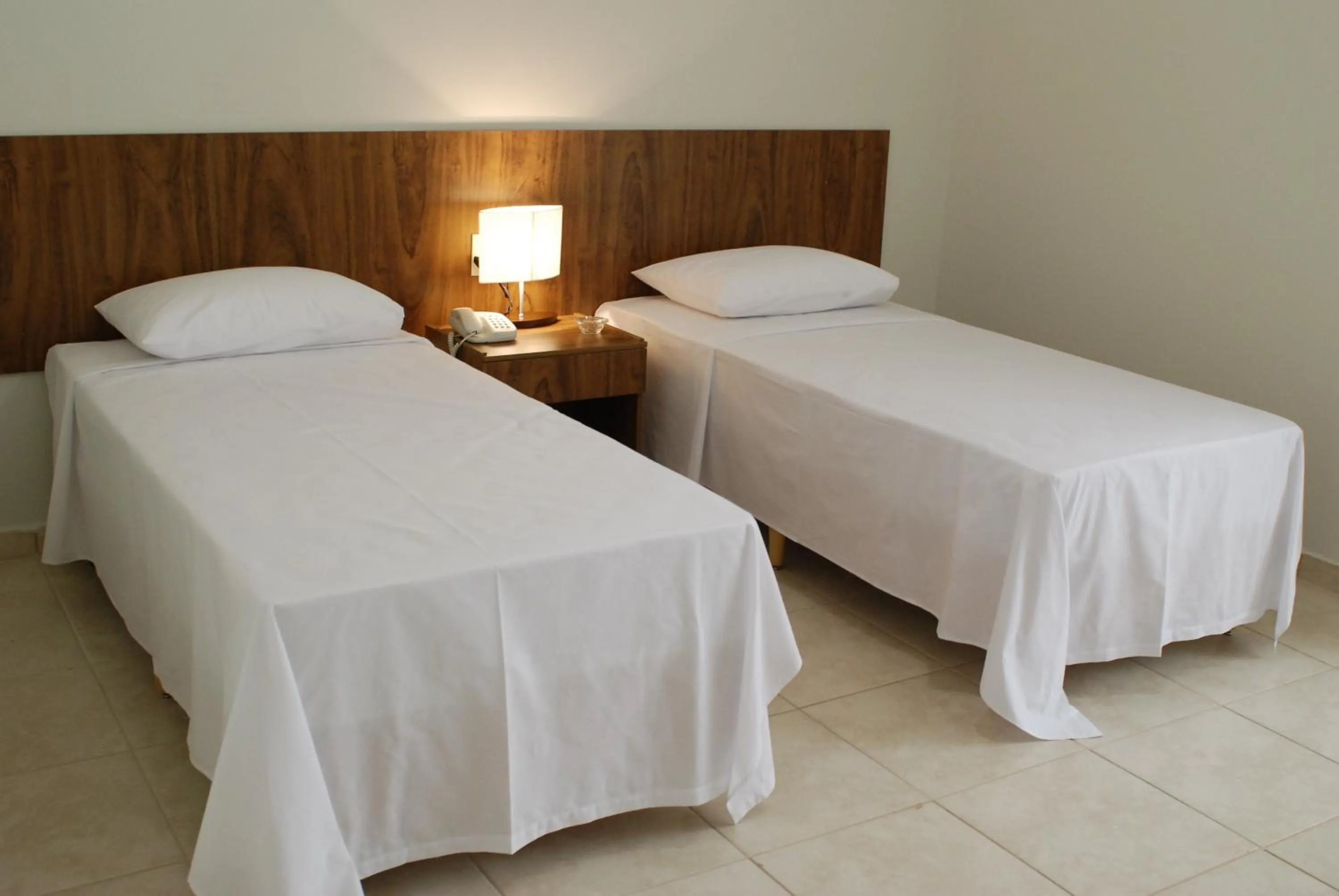 Bed in Monte Castro Executive Hotel