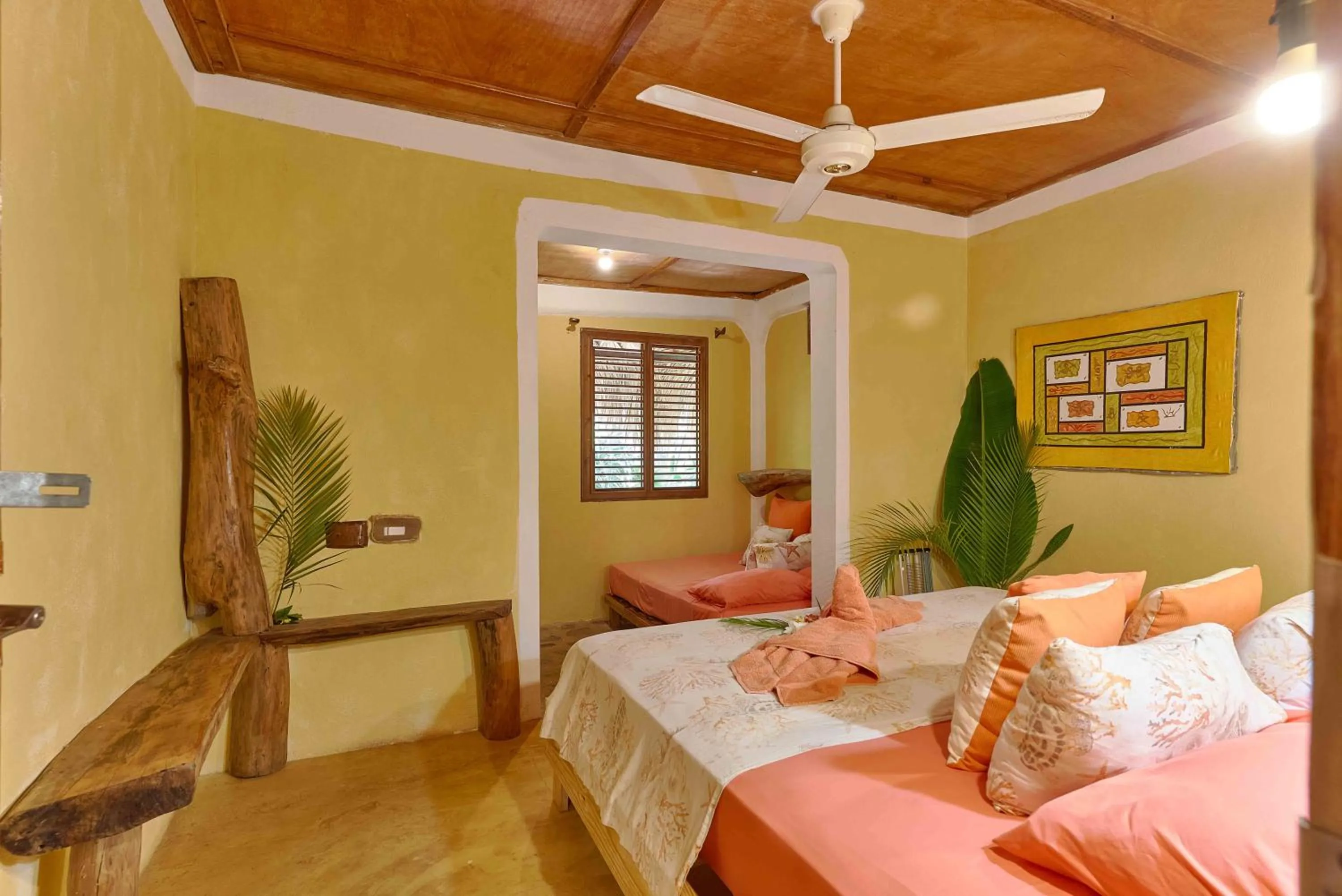 Bed in CHALET TROPICAL Hotel & Restaurant-Pizzeria