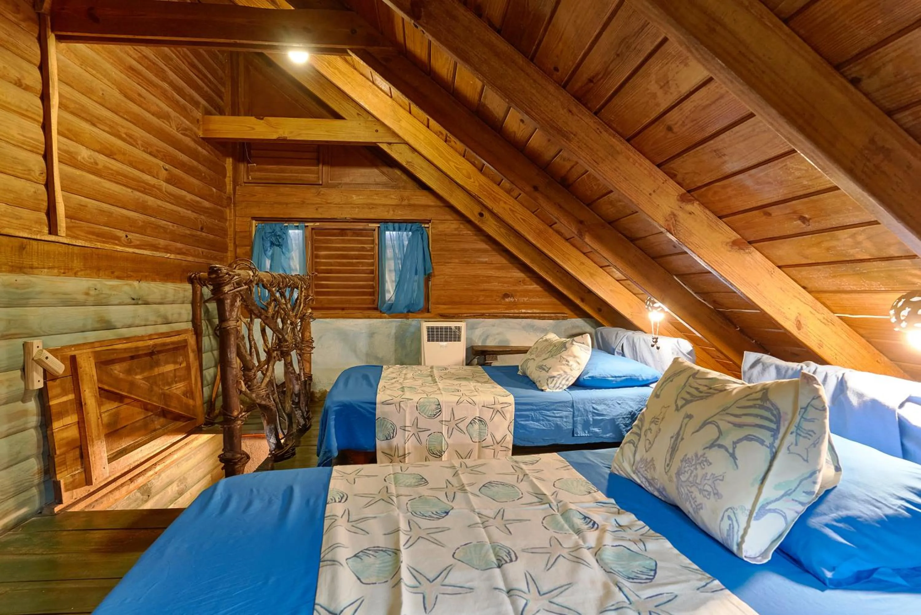 Bed in CHALET TROPICAL Hotel & Restaurant-Pizzeria