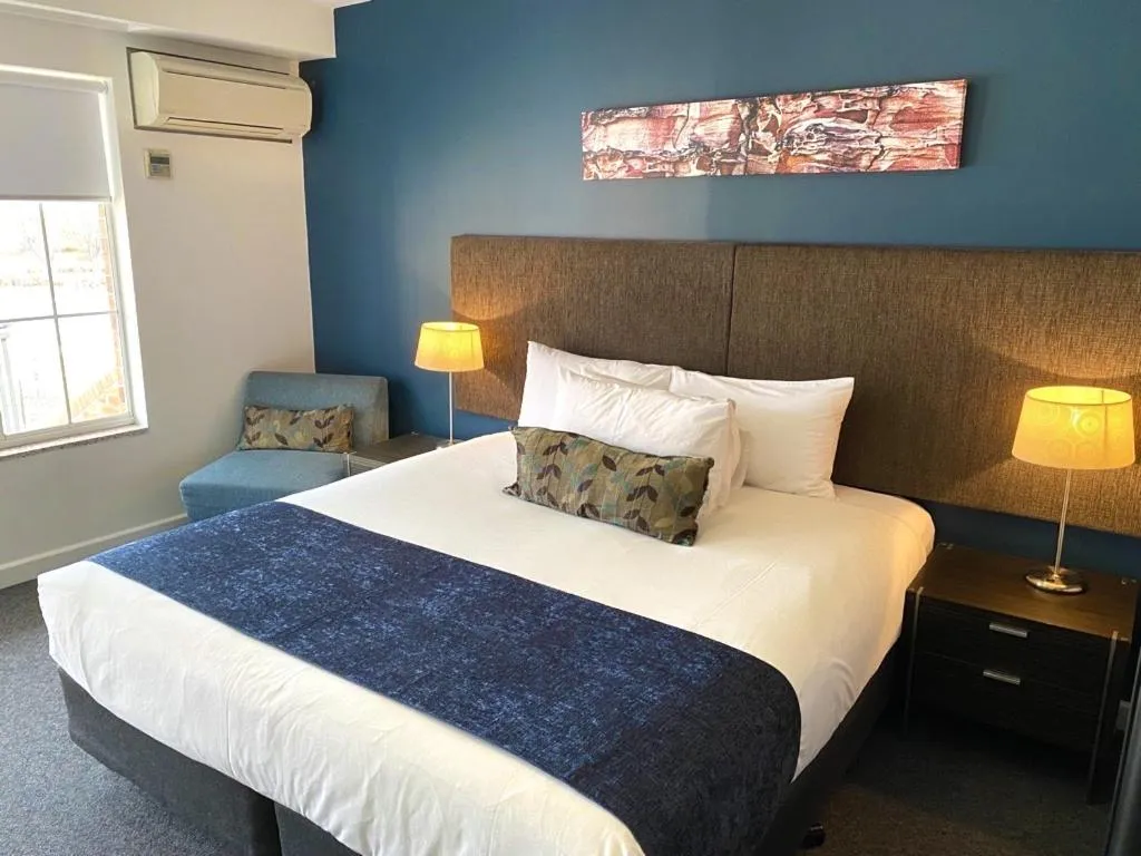 Bed in Golden Age Motor Inn