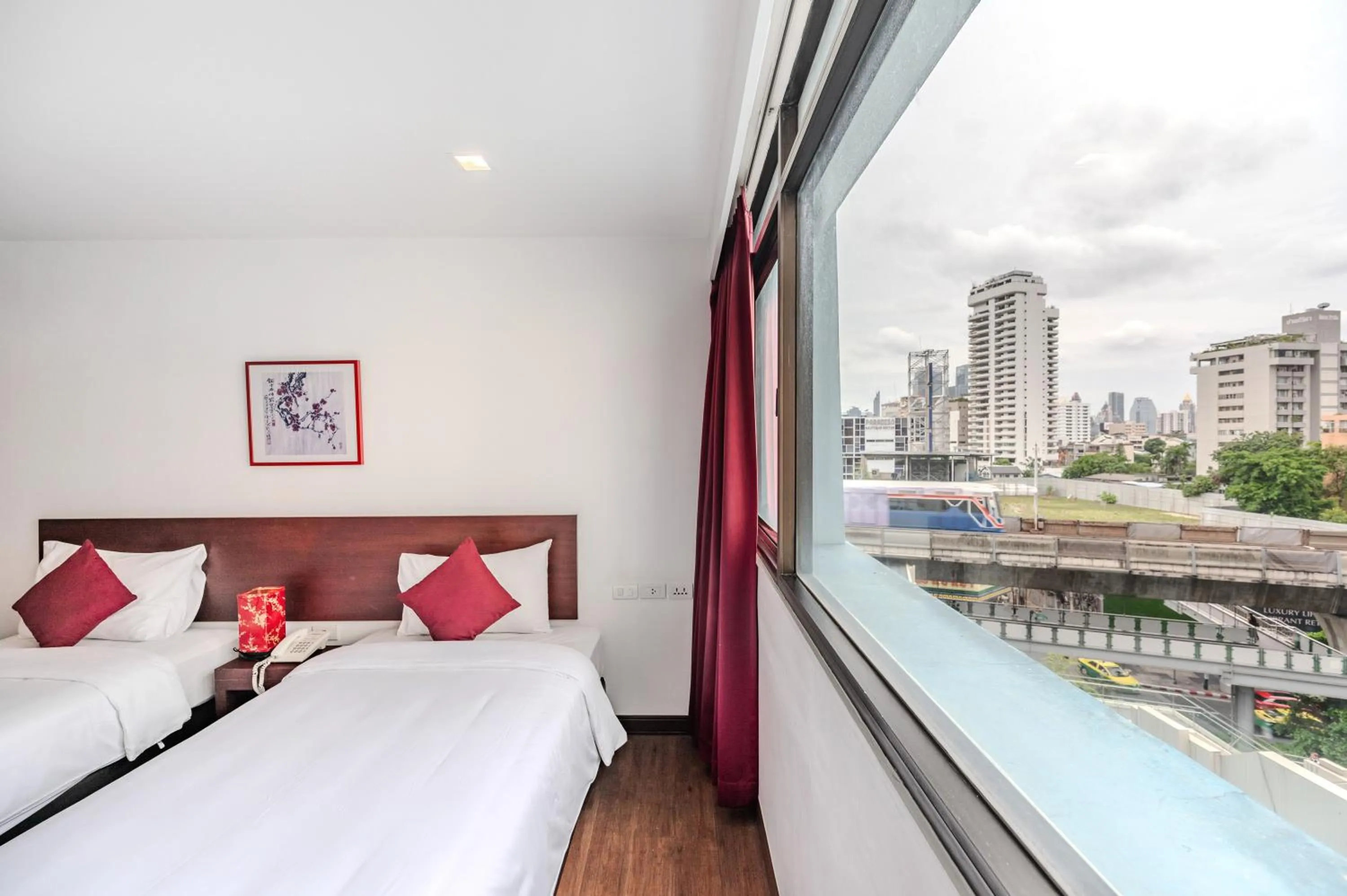 Bed in Ruamchitt Plaza Hotel