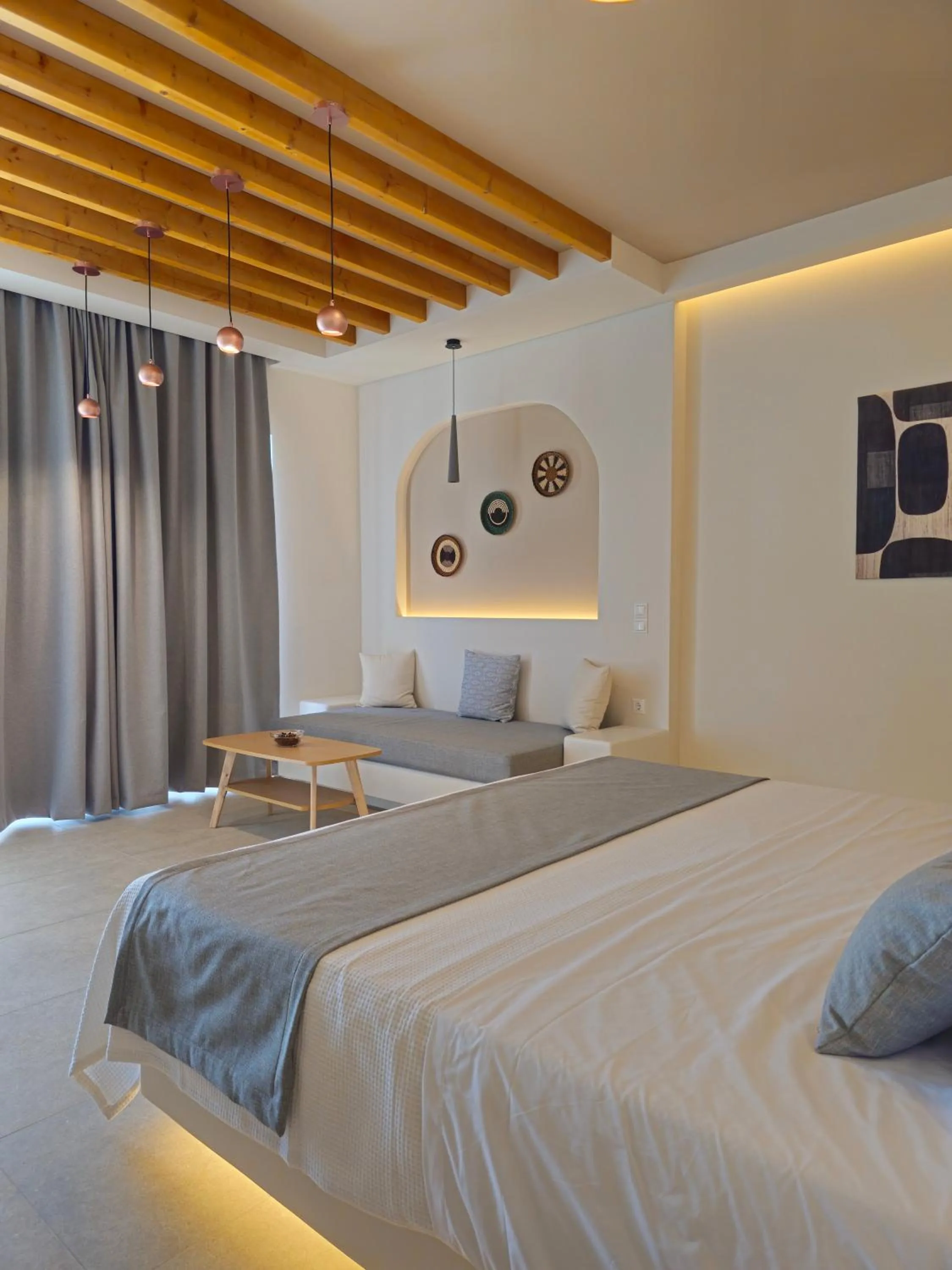 Seating area, Bed in Moonlight Apartments & Suites