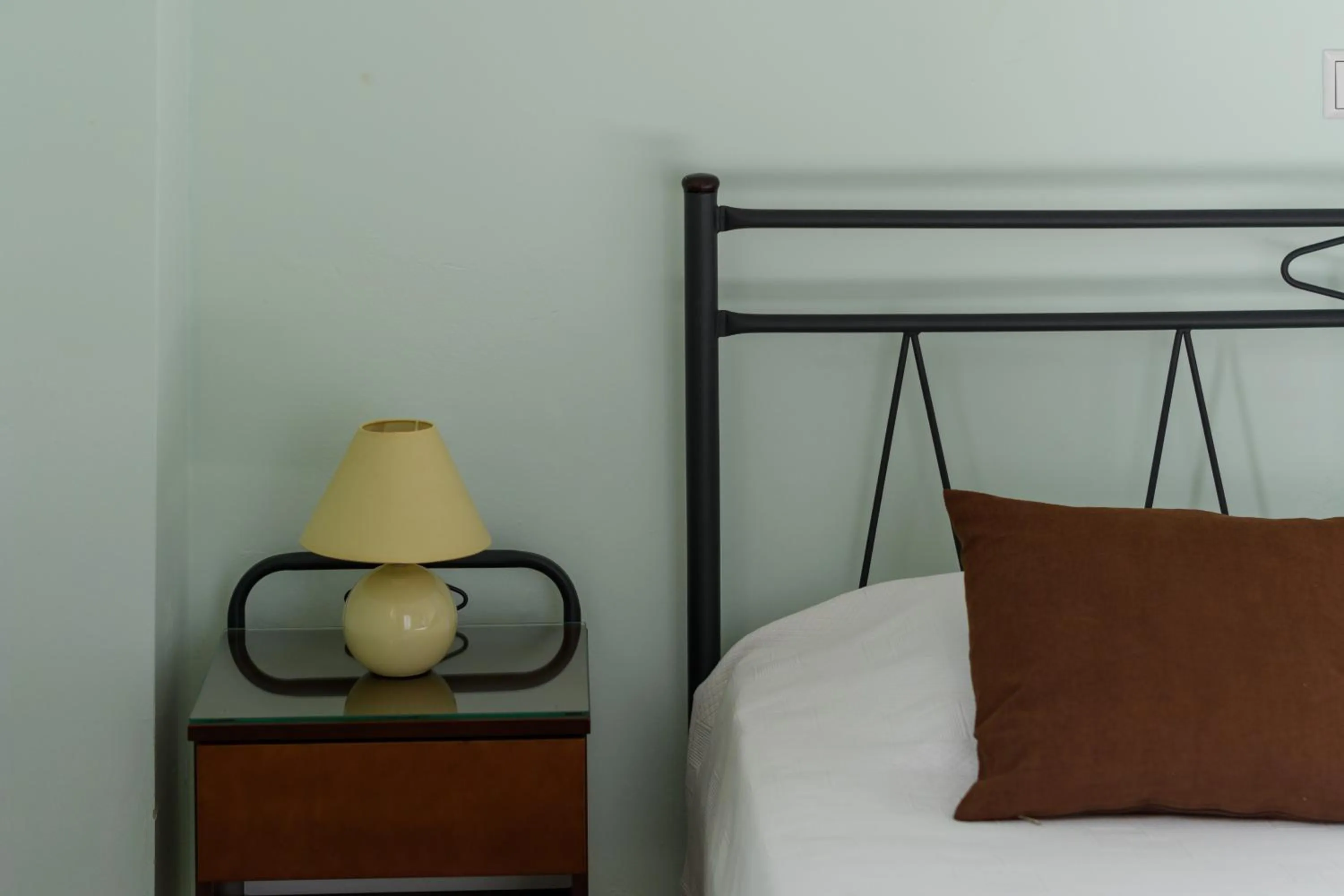 Bedroom, Bed in Moonlight Apartments & Suites