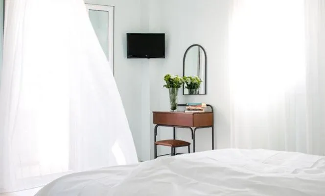 Bed in Moonlight Apartments & Suites