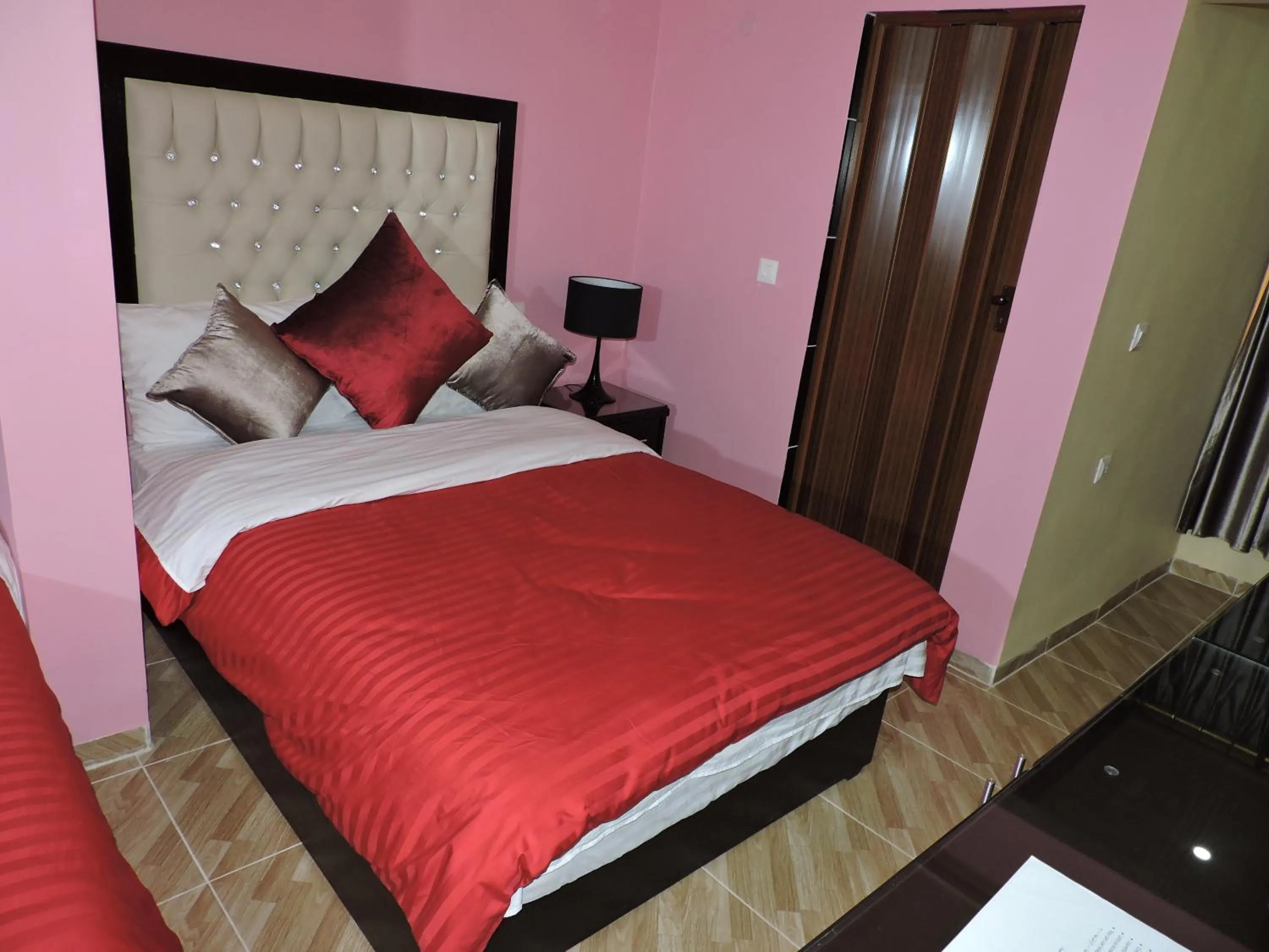 Bed in Valentine Inn Luxury